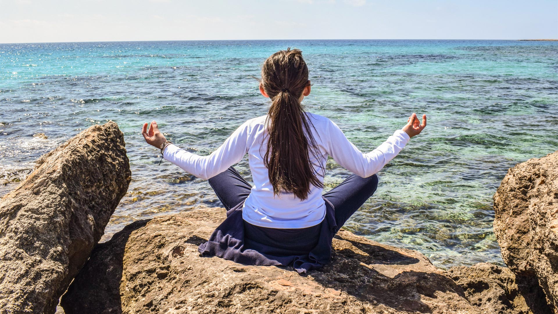 Namaste girl at the beach