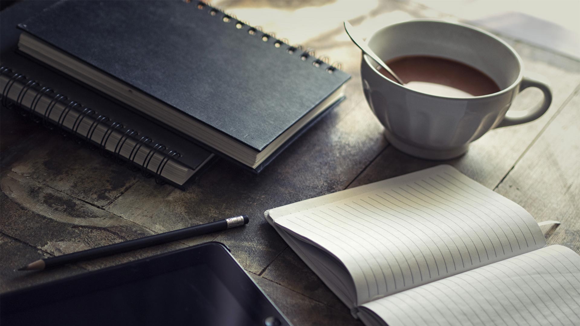 Coffee cup and journals