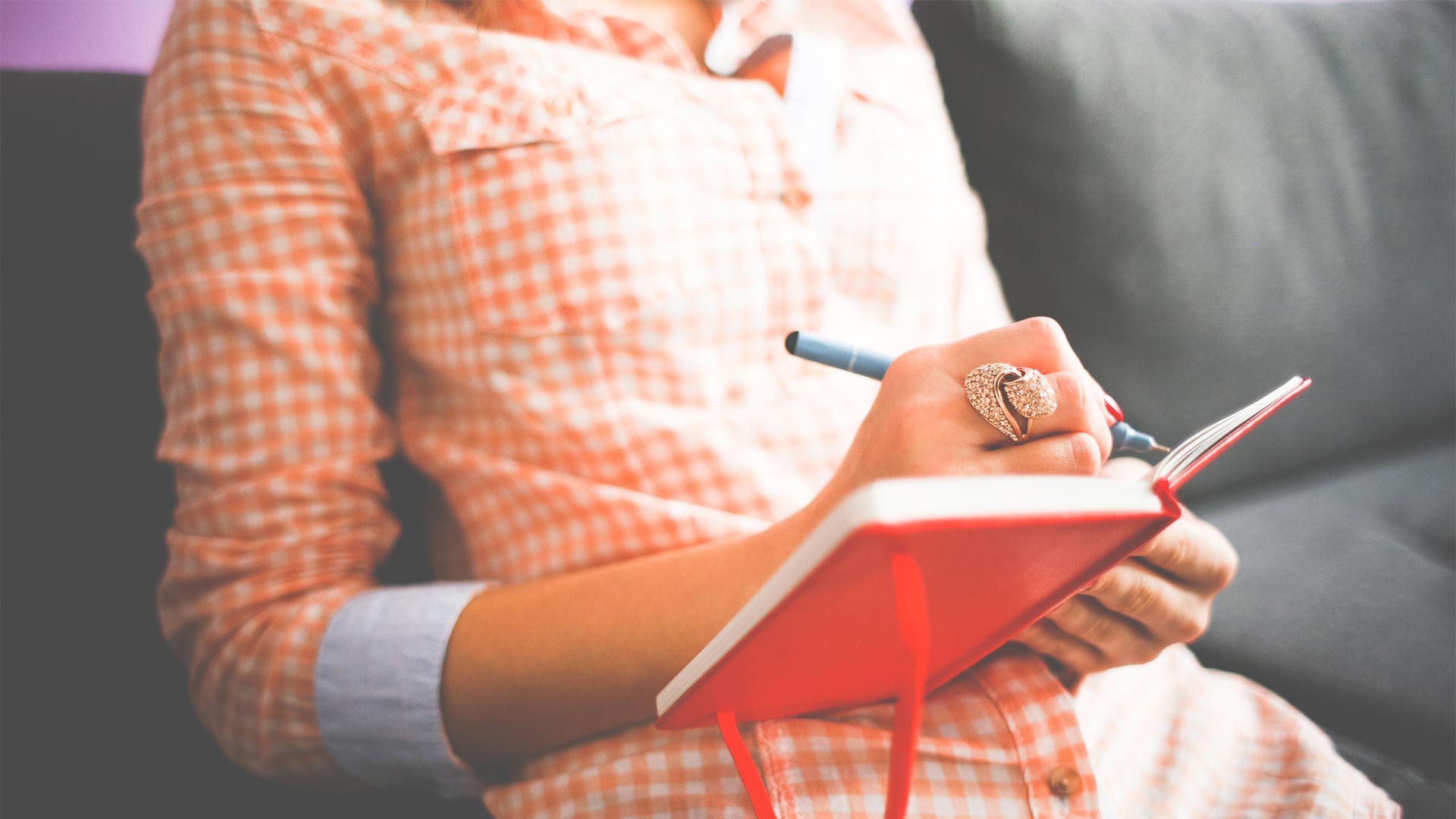 Woman writing in a journal