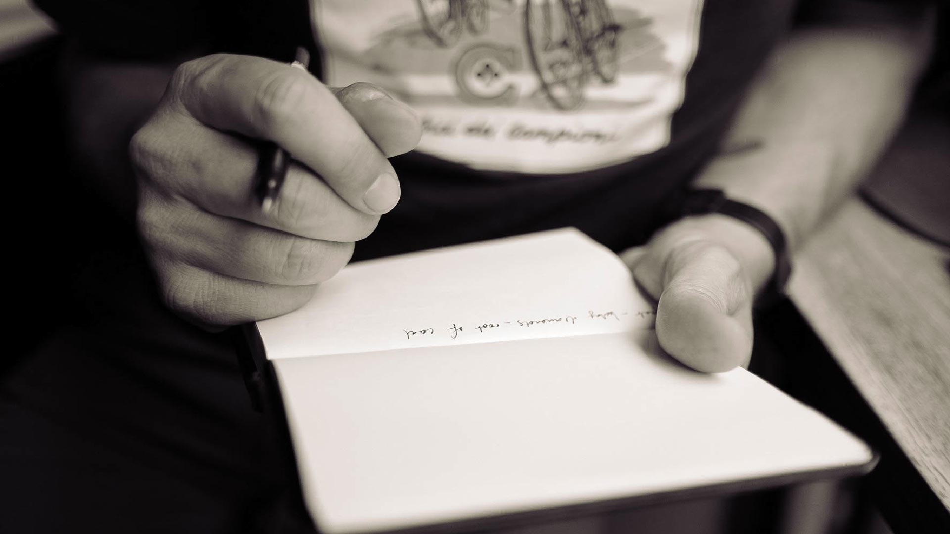 Person writing in journal