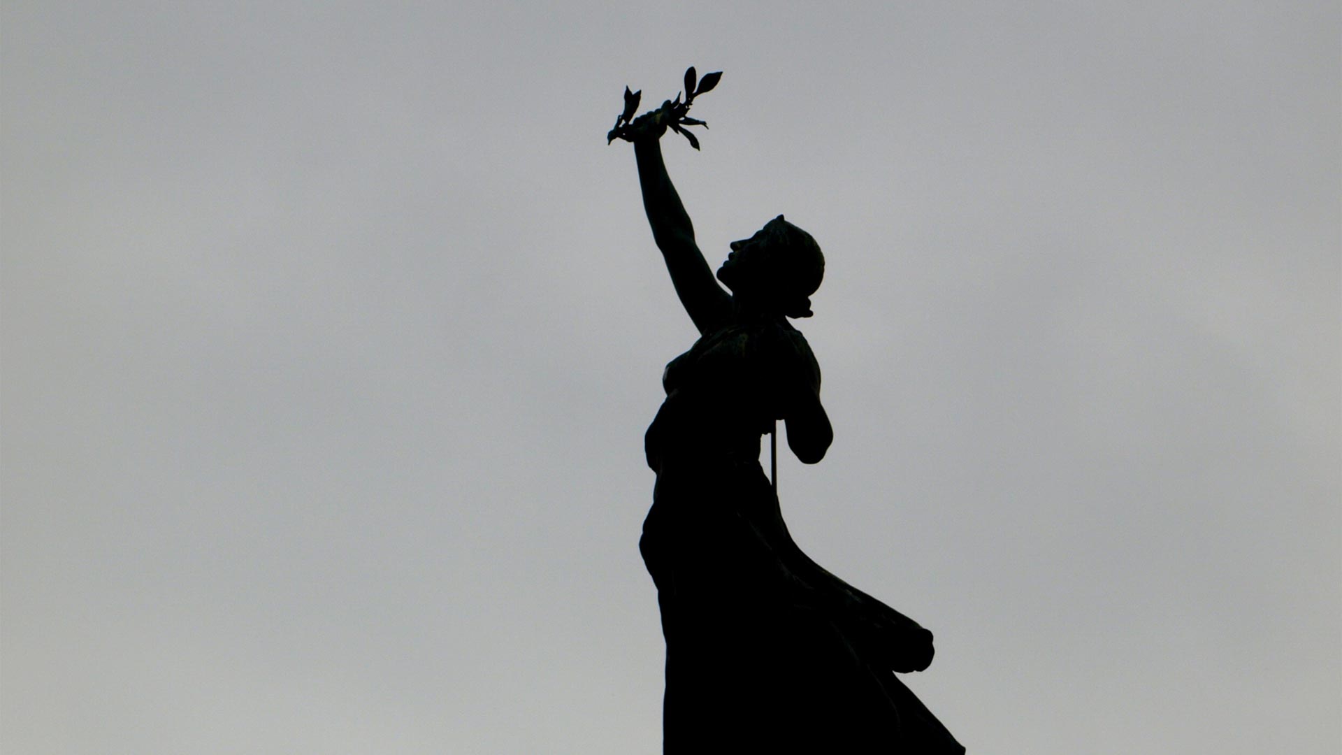 Statue of a woman holding laurels