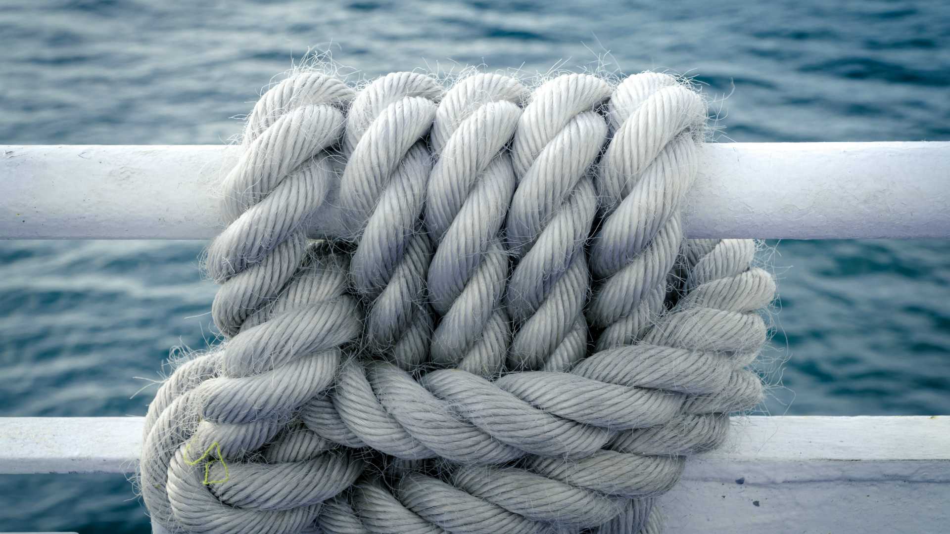 ropes tied on the side of a boat