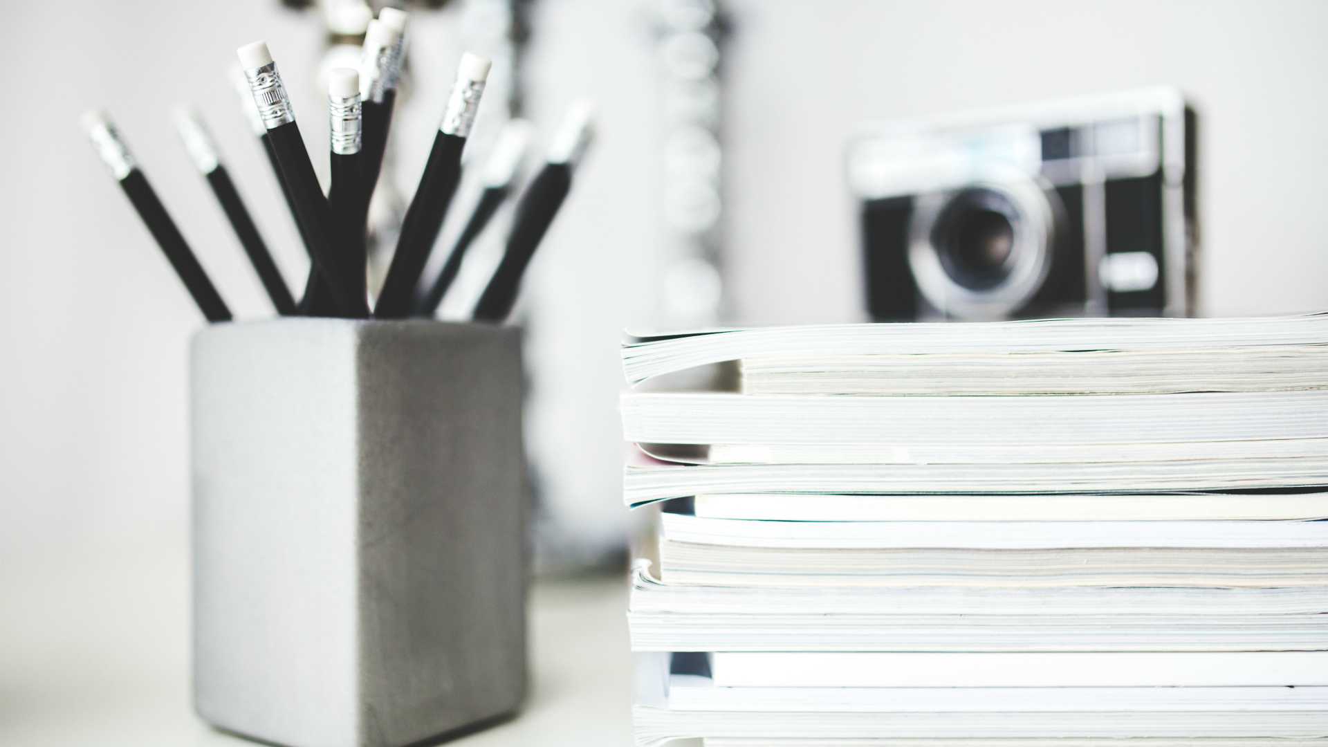 pencils, notebooks and camera