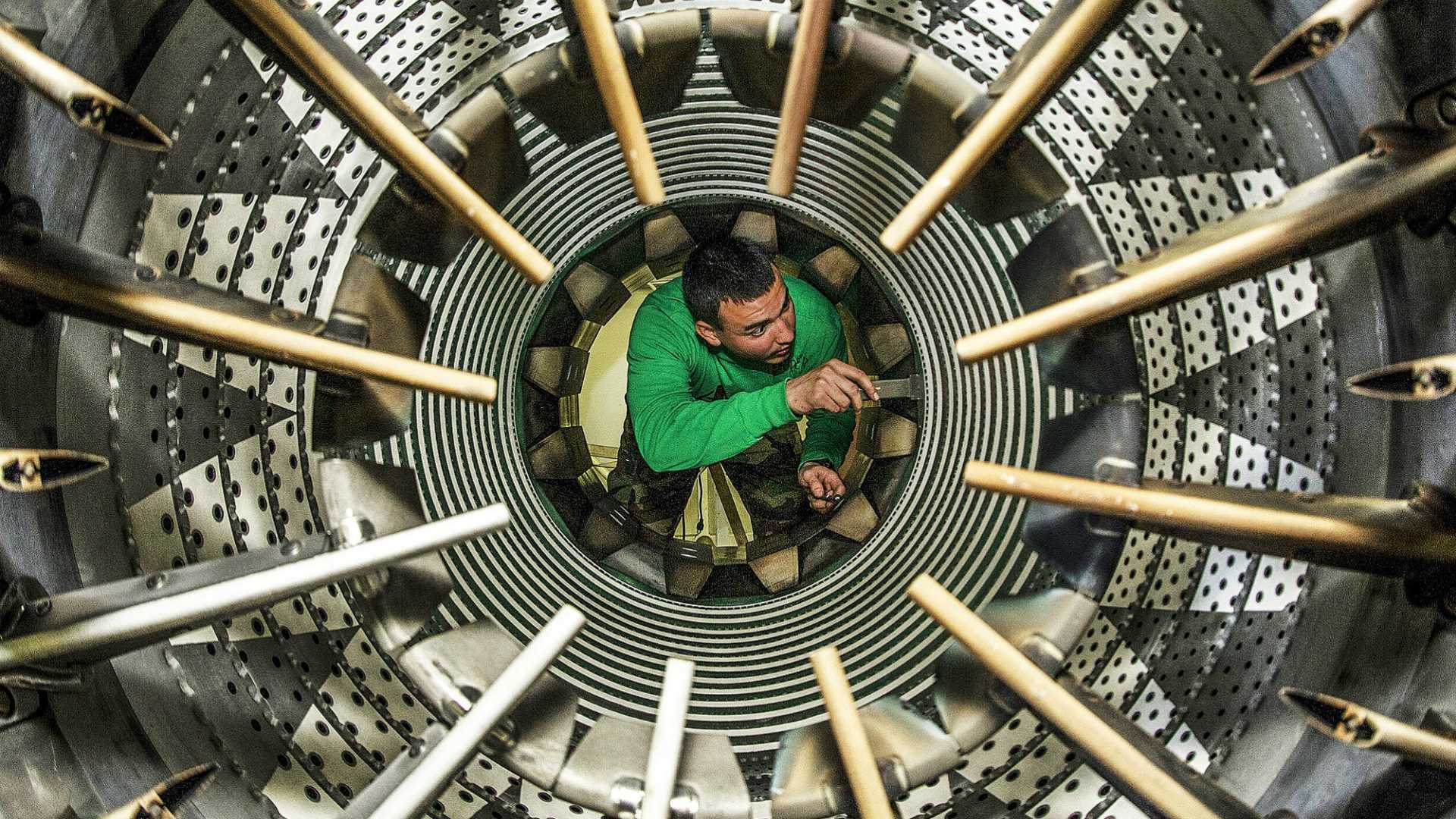 man fixing a machine