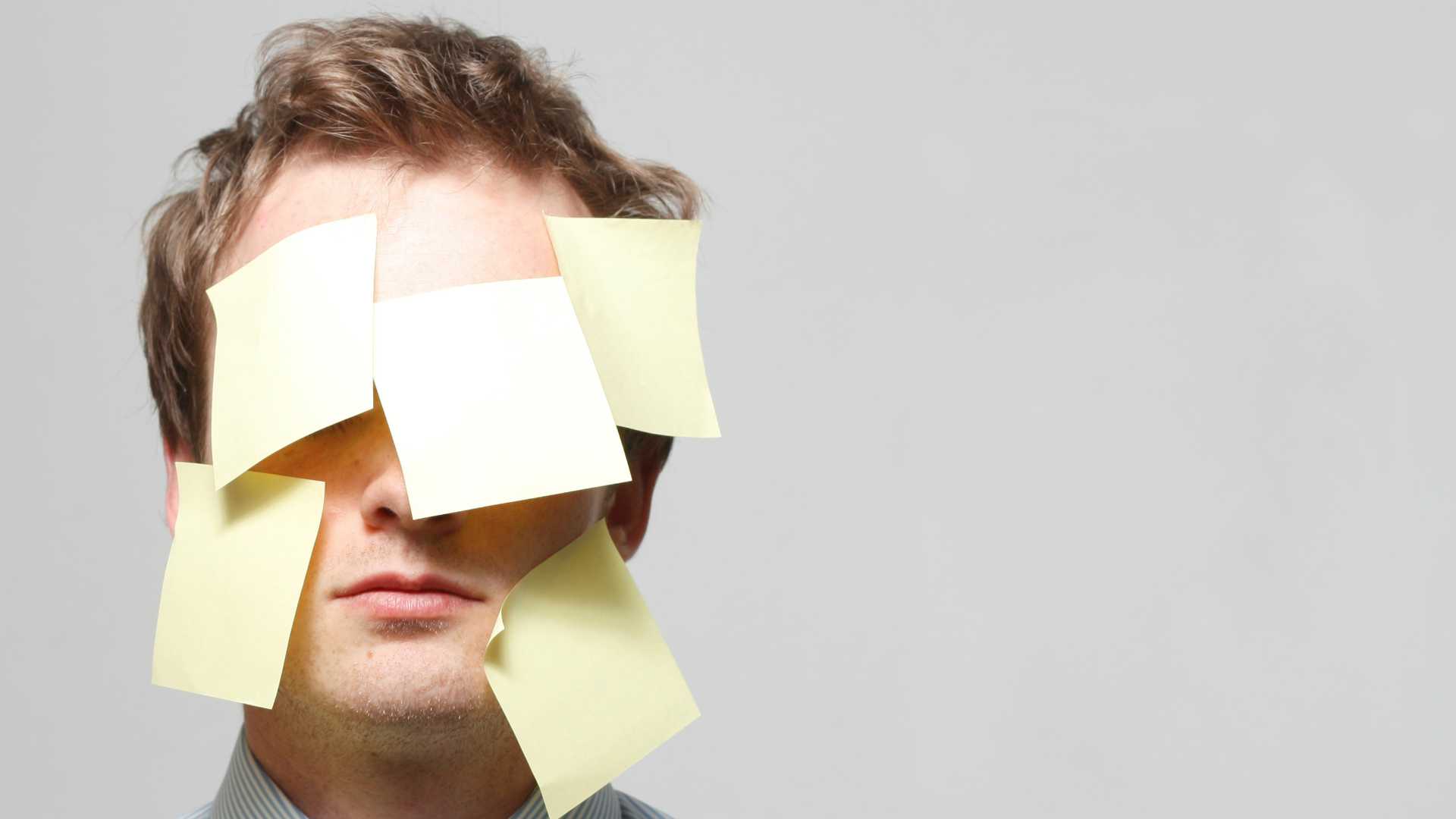 man with sticky notes on his face