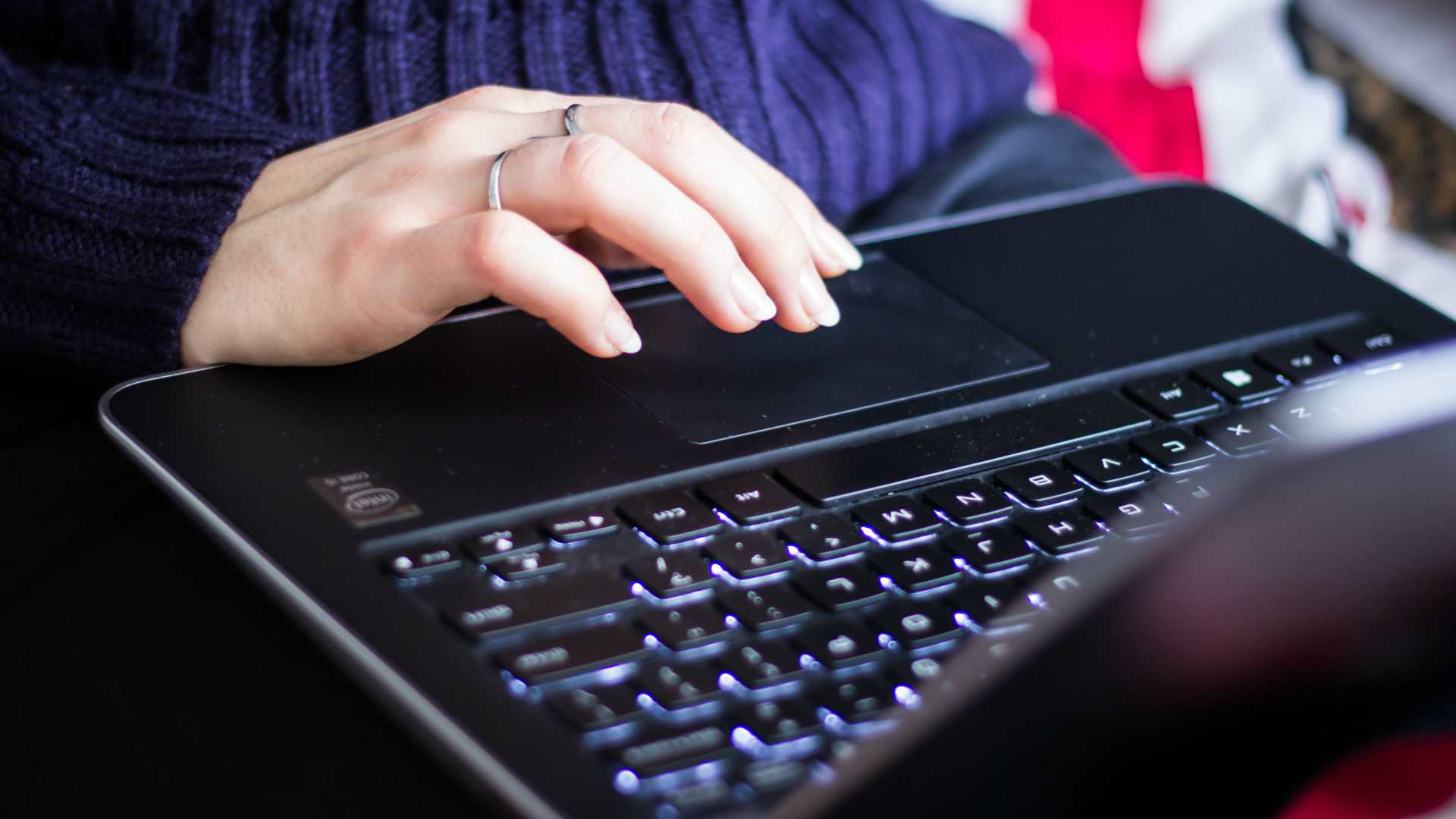 woman typing on a laptop