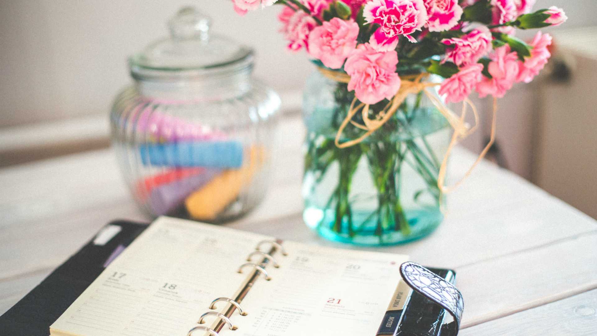 agenda and vase with flowers