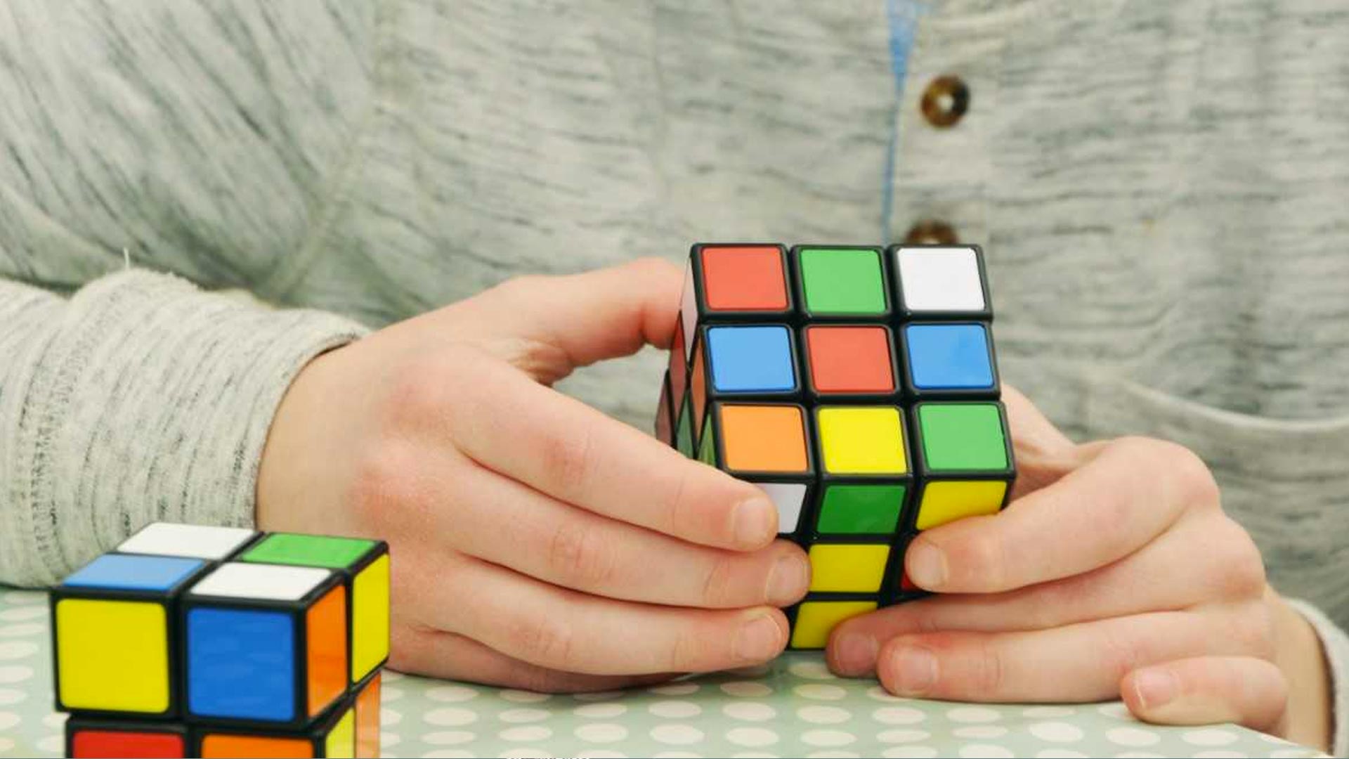 man solving a Rubik's cube