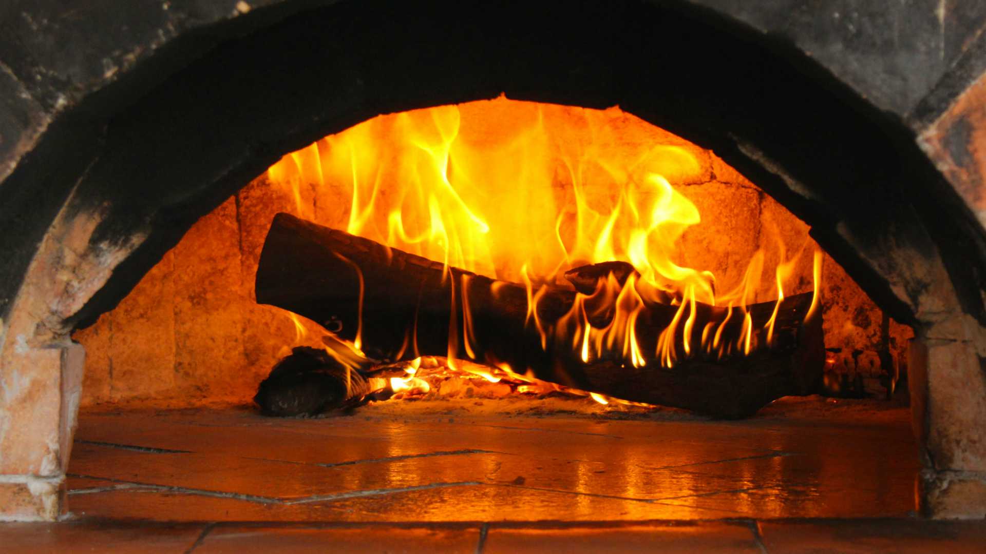 fire burning in a log fireplace