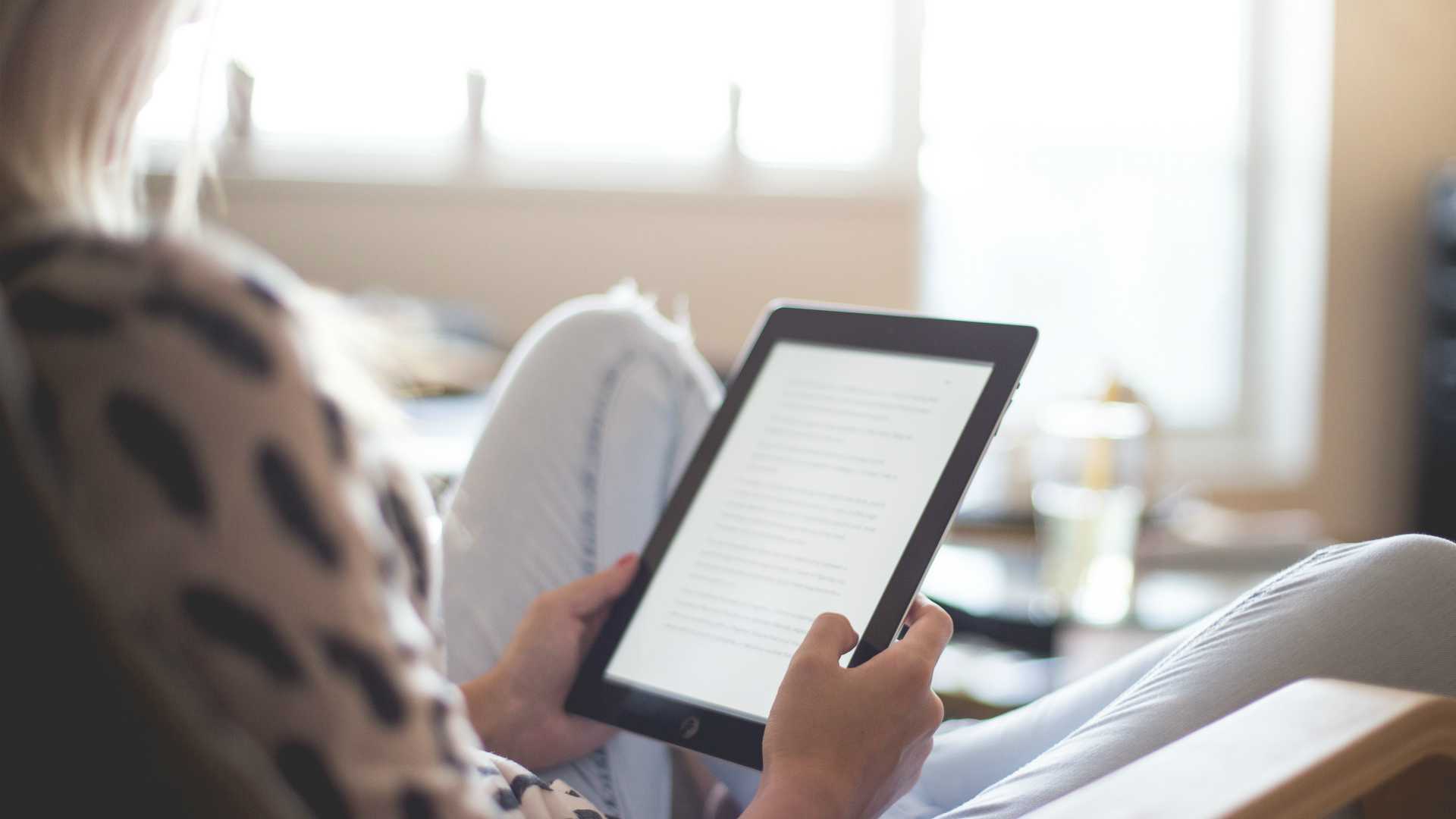 woman reading an e-book