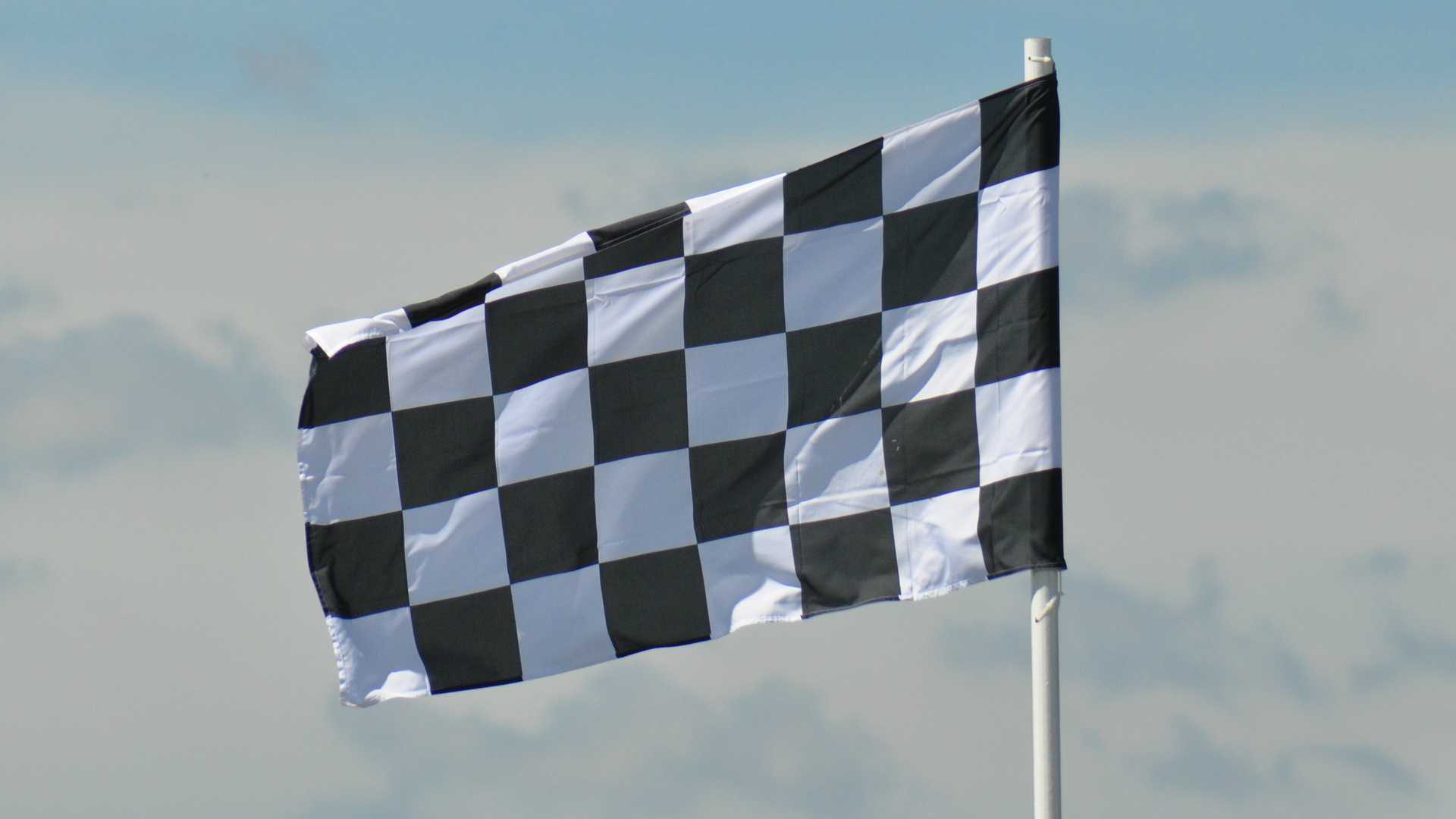 checkered flag waving against the sky