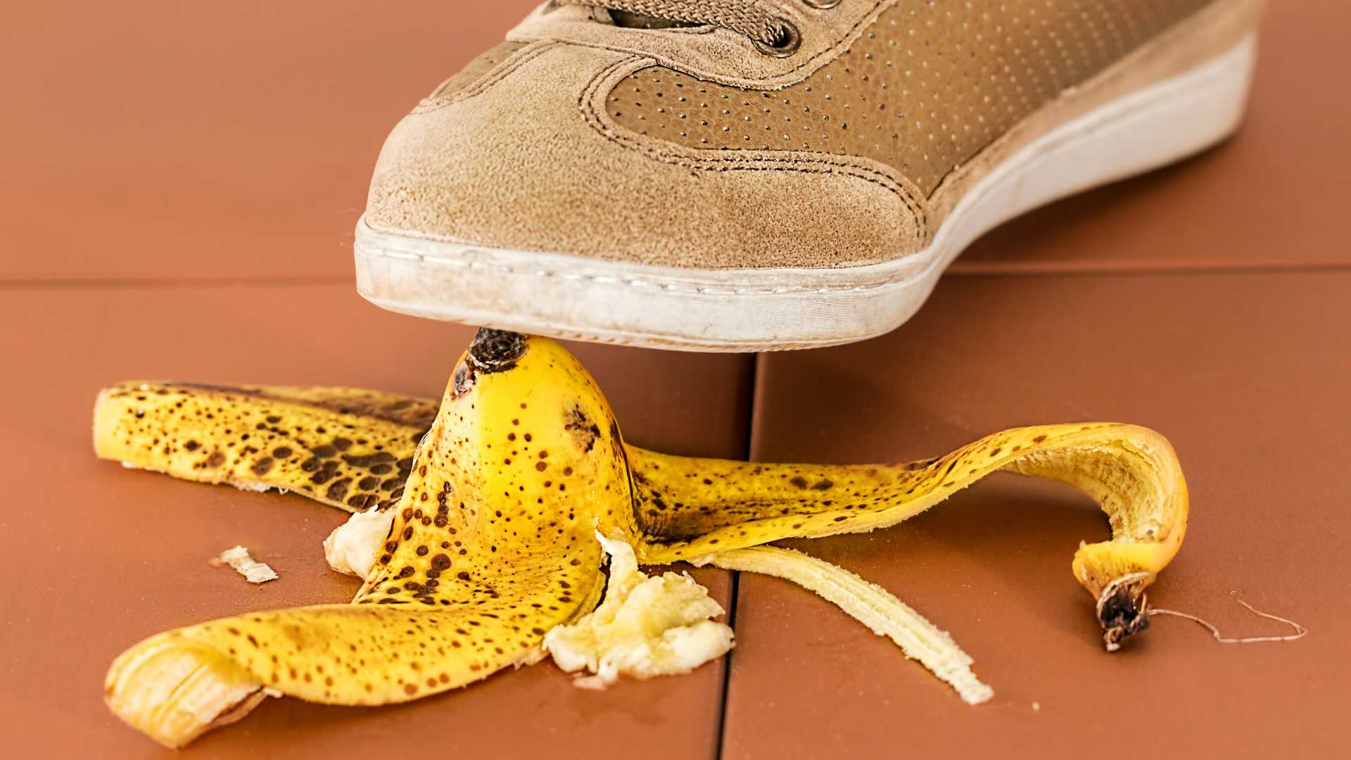 person stepping on a banana peel