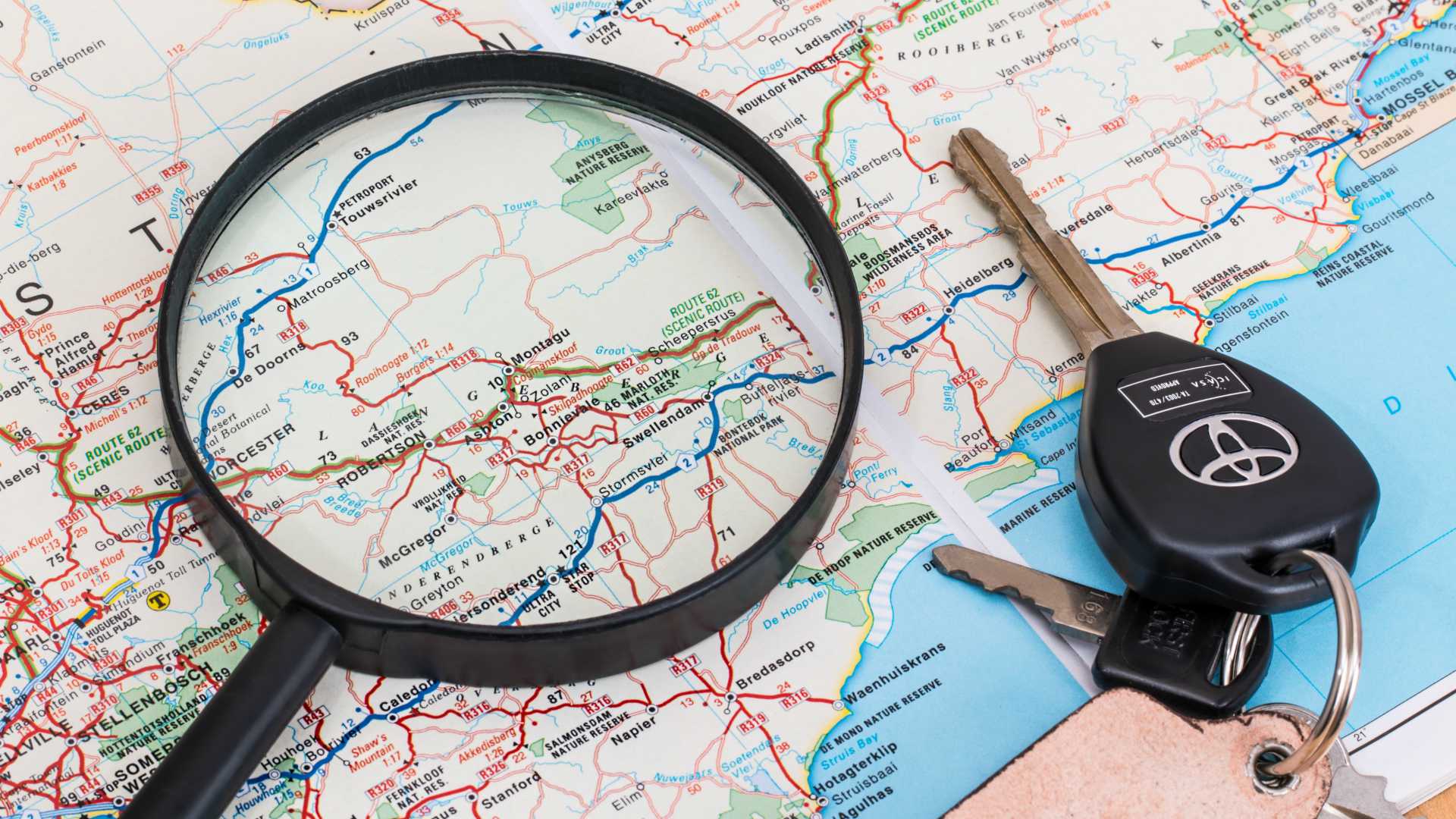 map with magnifying glass and keys