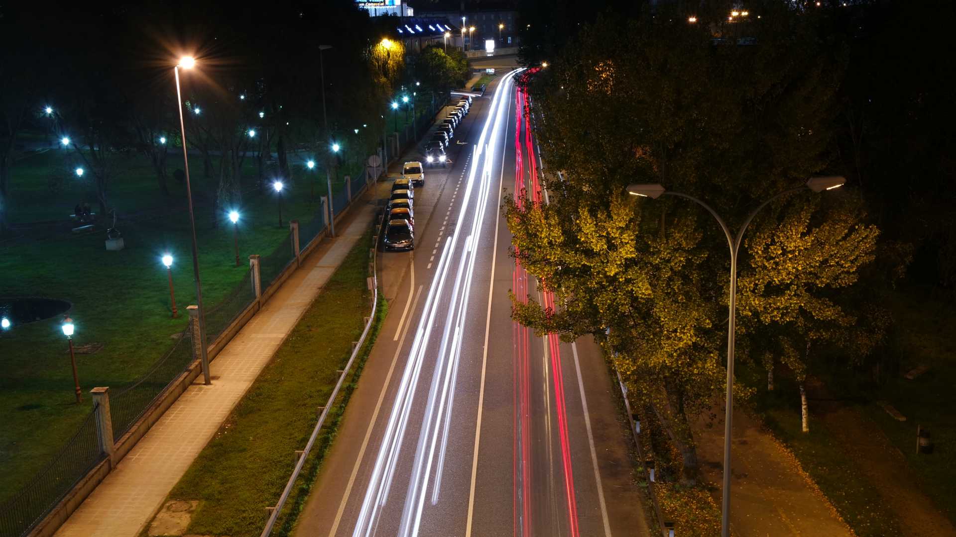 cars merging onto a highway at night