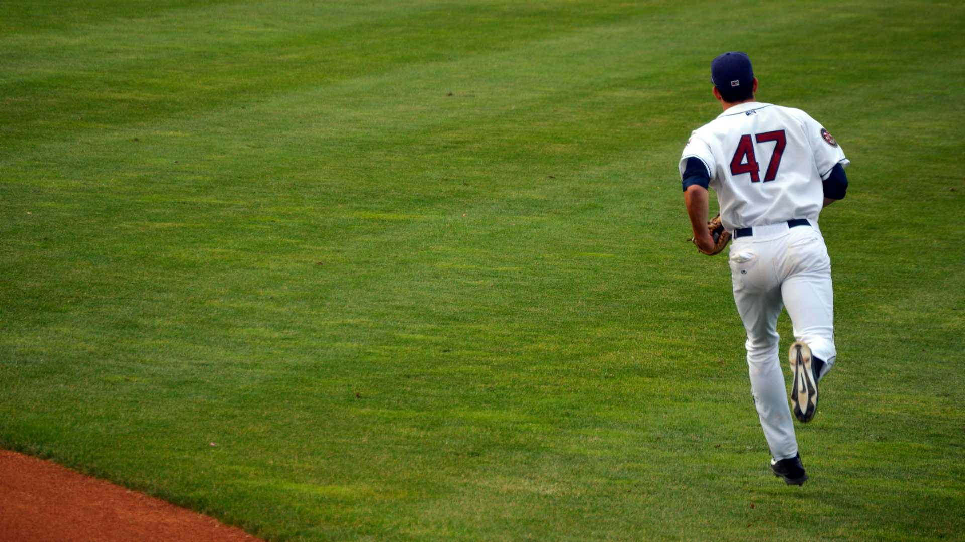 baseball player running off the field