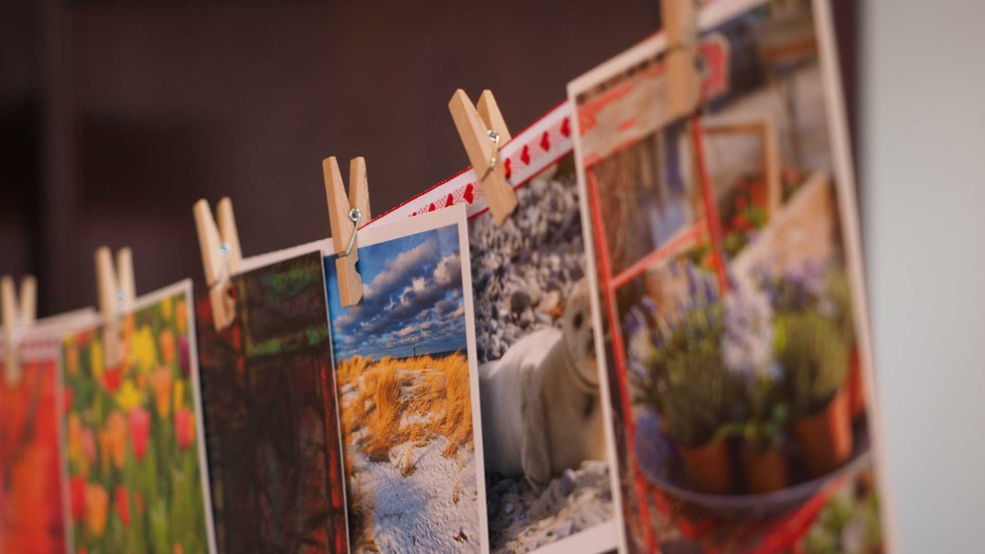 photos hanging with clothespins