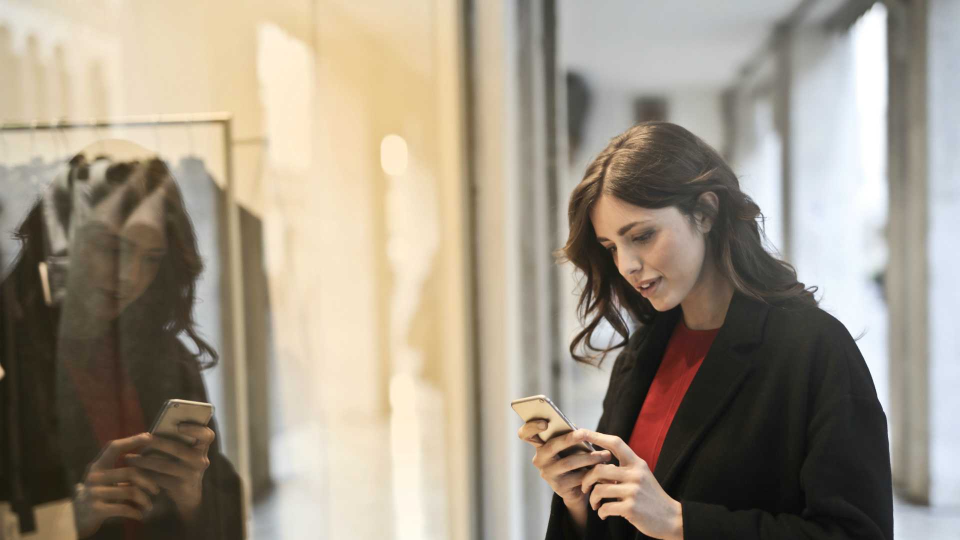 woman on a mobile phone at a store