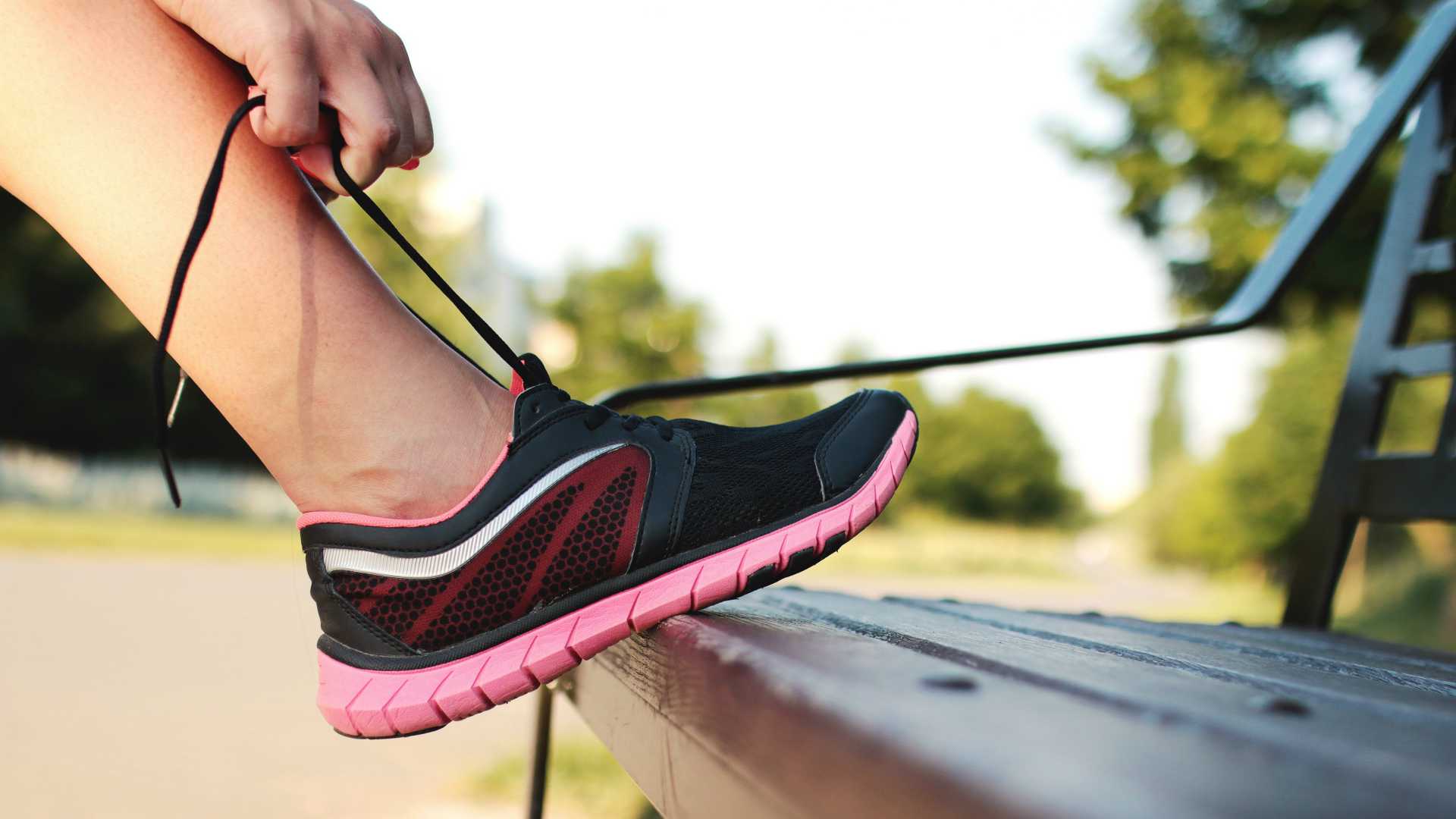 woman tying shoelaces