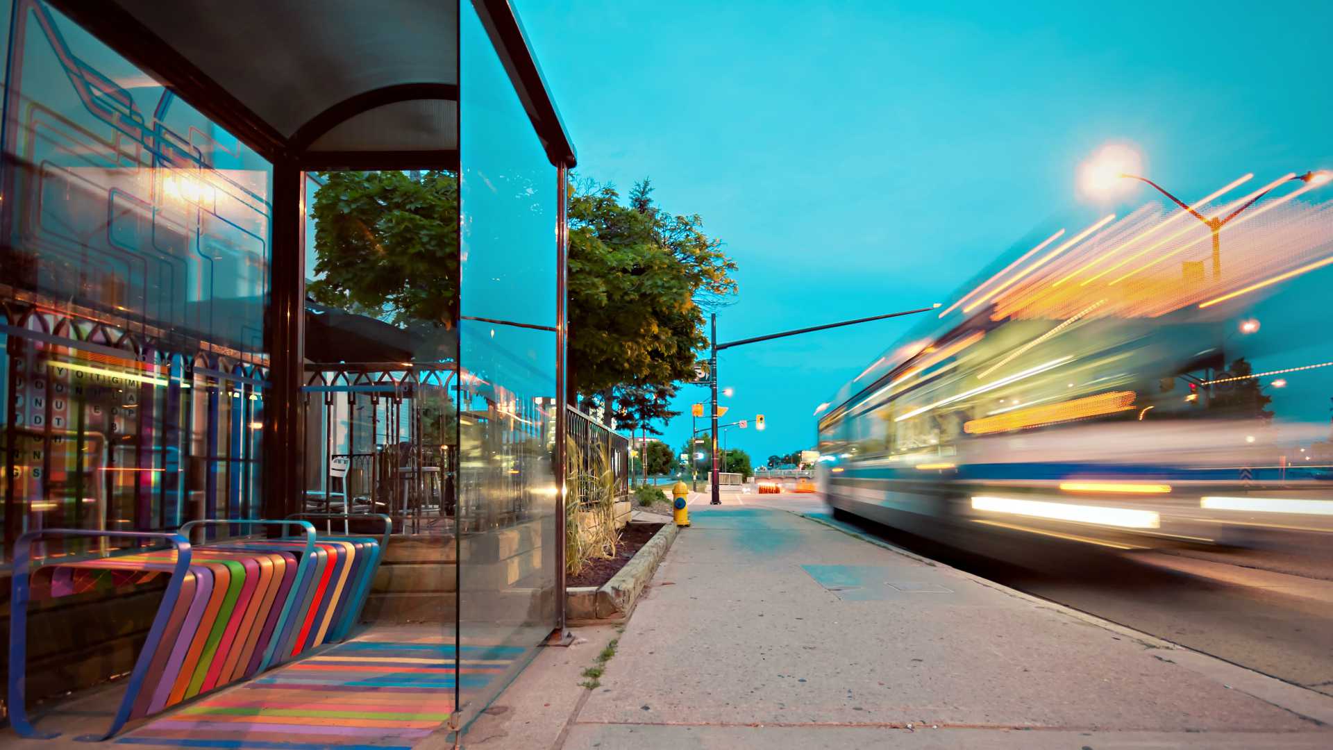 bus stop with speeding bus