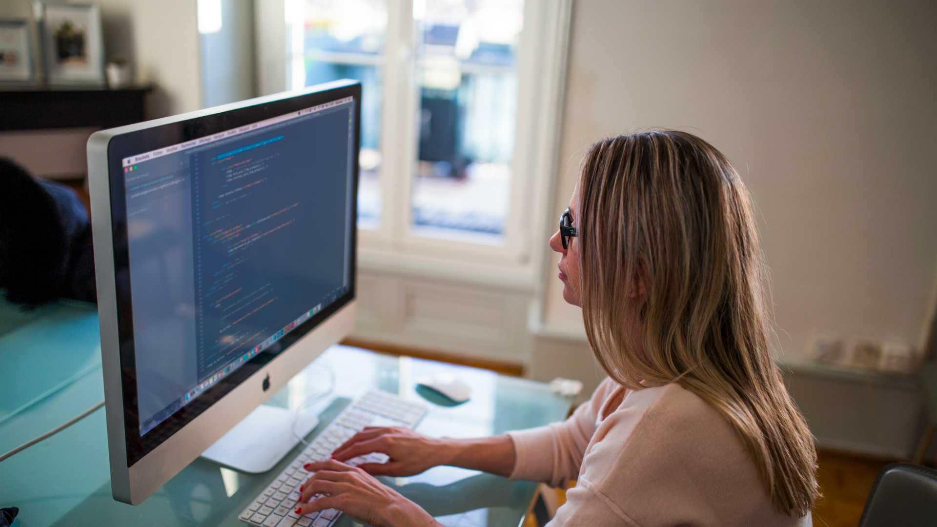 woman working on computer code