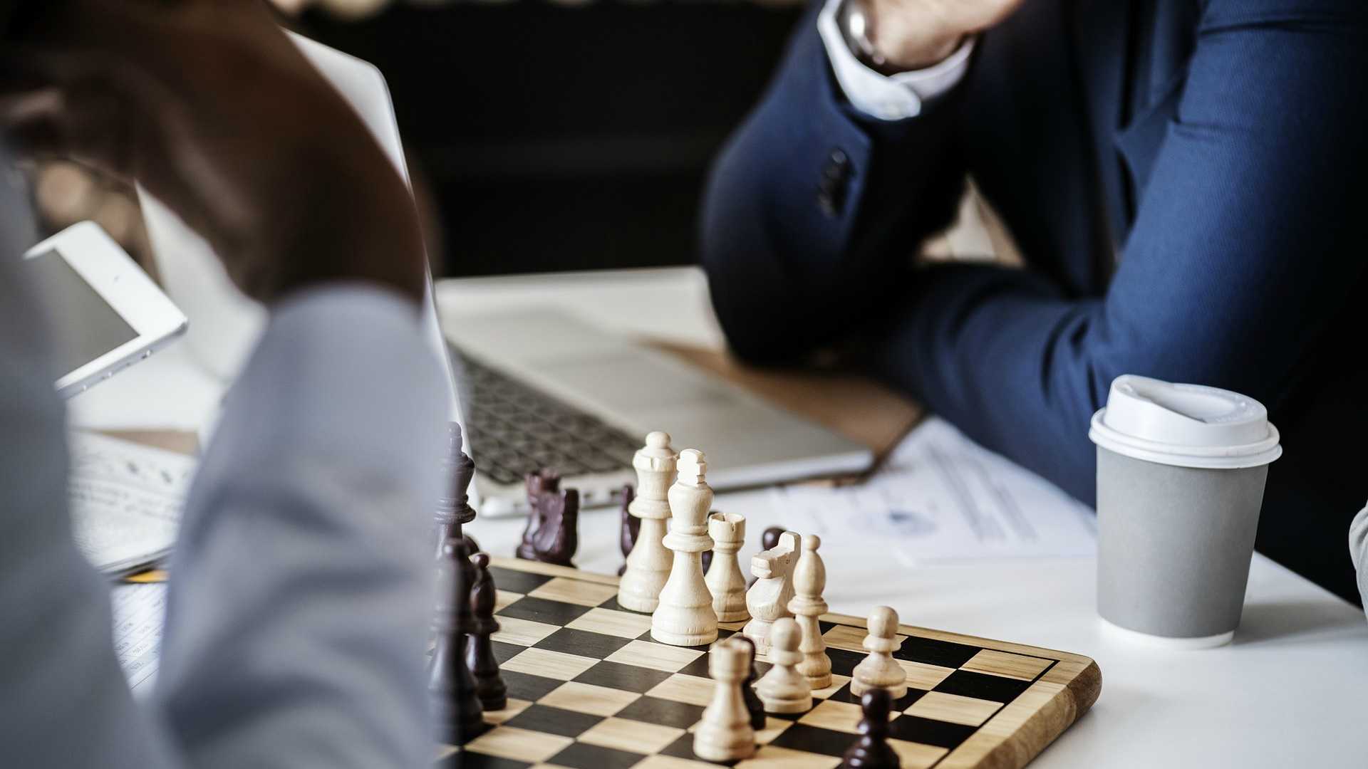 businesspeople playing chess