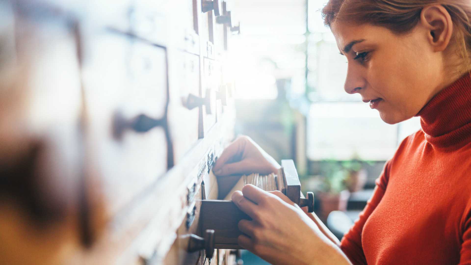 woman using a card catalog