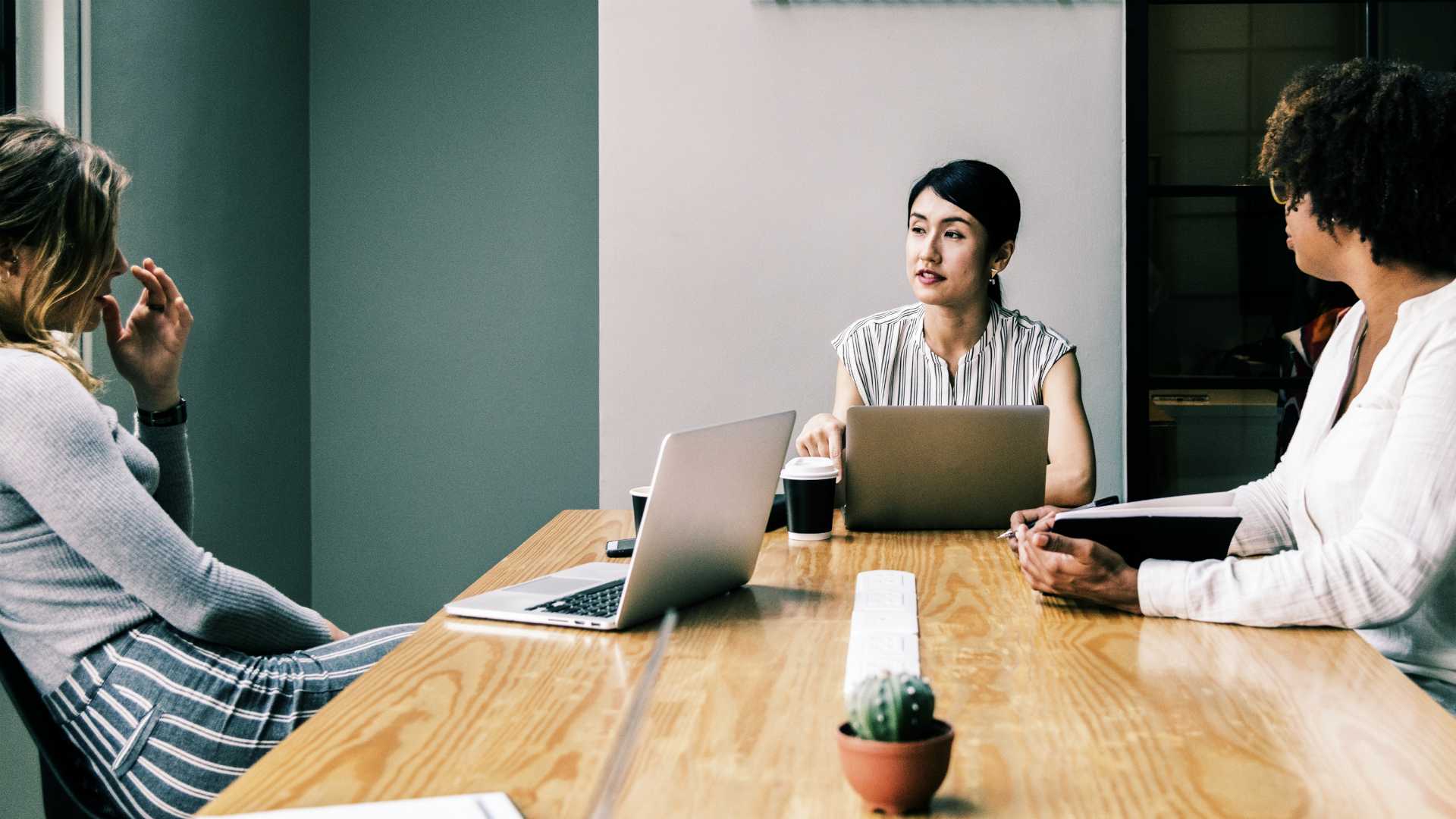 women working at a conference table