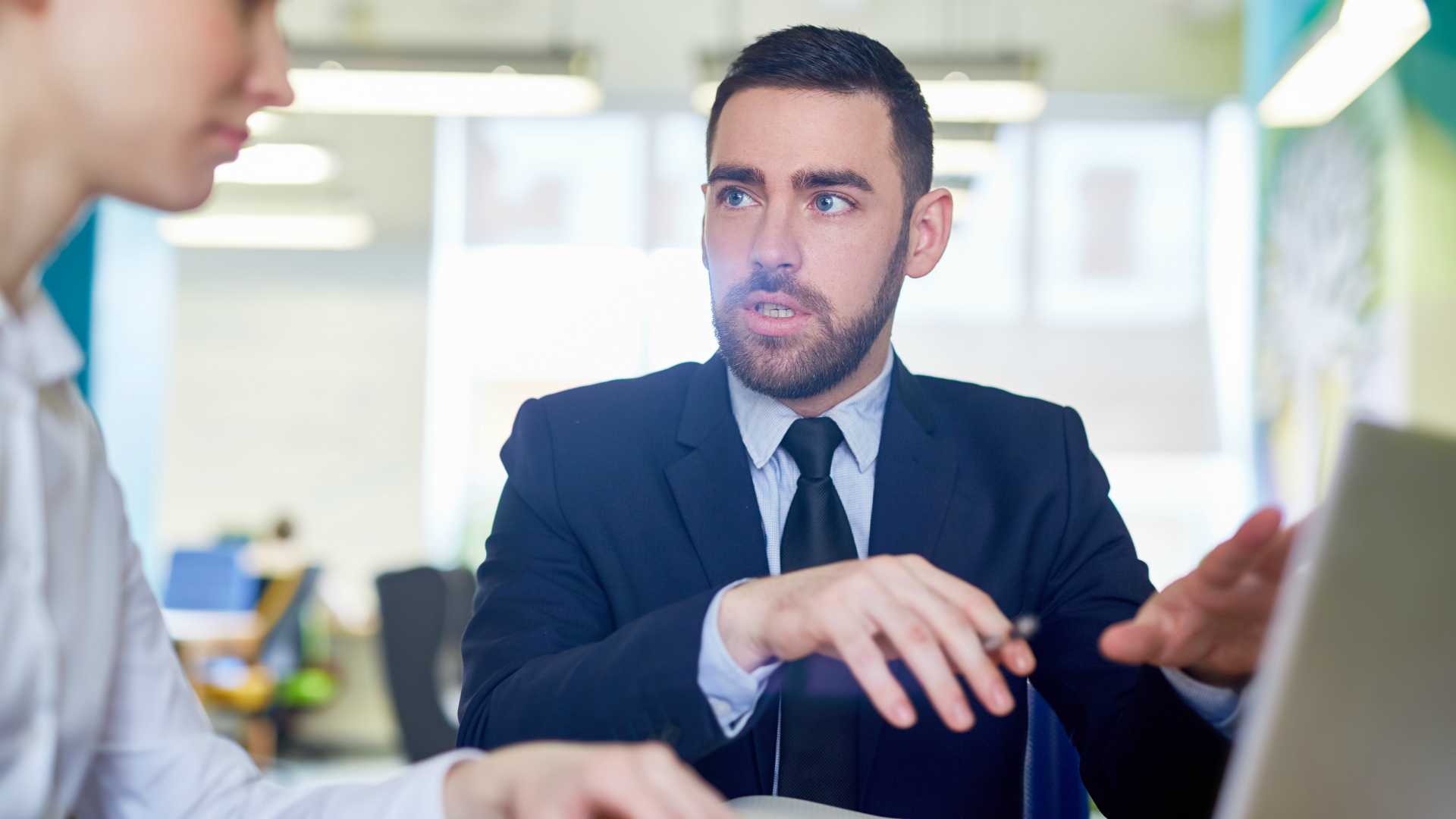businessman presenting to a businesswoman