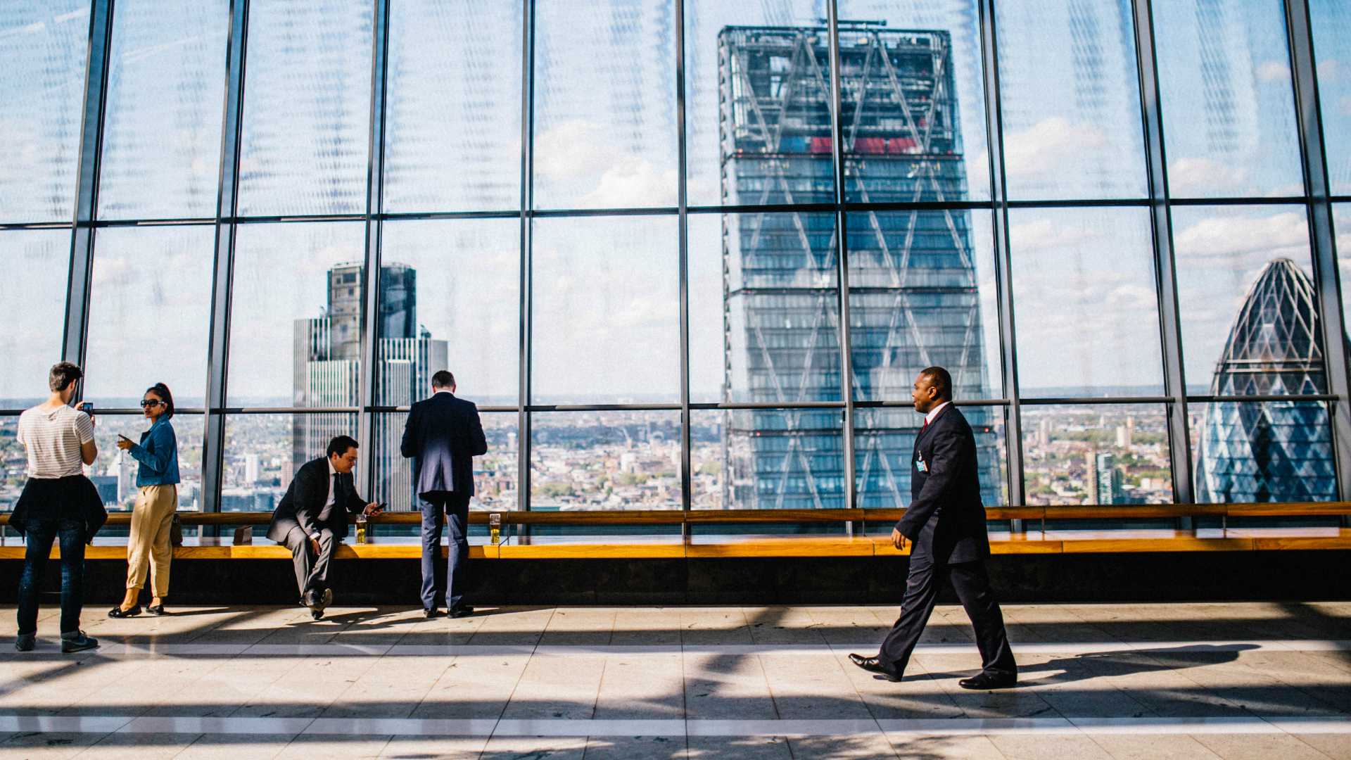 businesspeople walking in a skyscraper