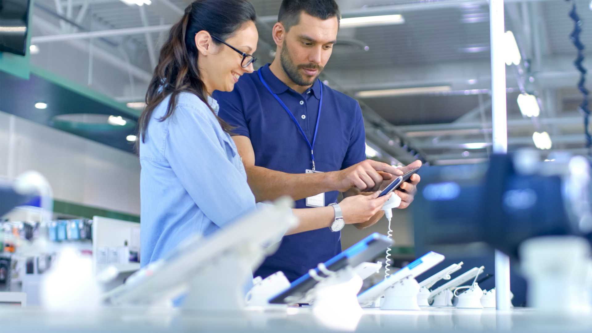 sales rep and customer in electronics store