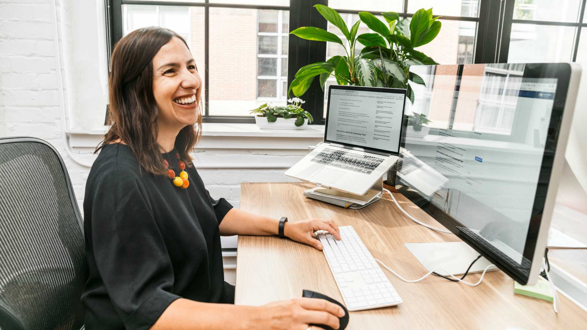 happy leader at her desk