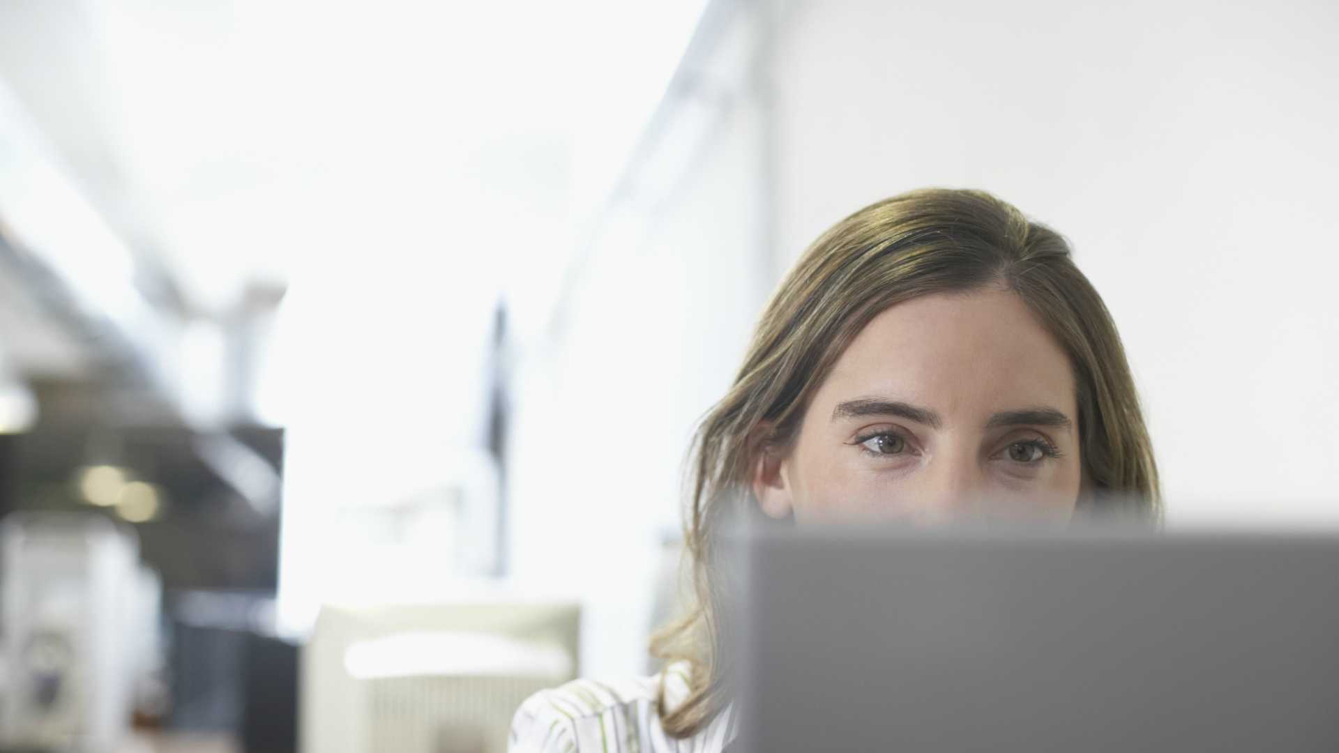 woman using a computer in an office