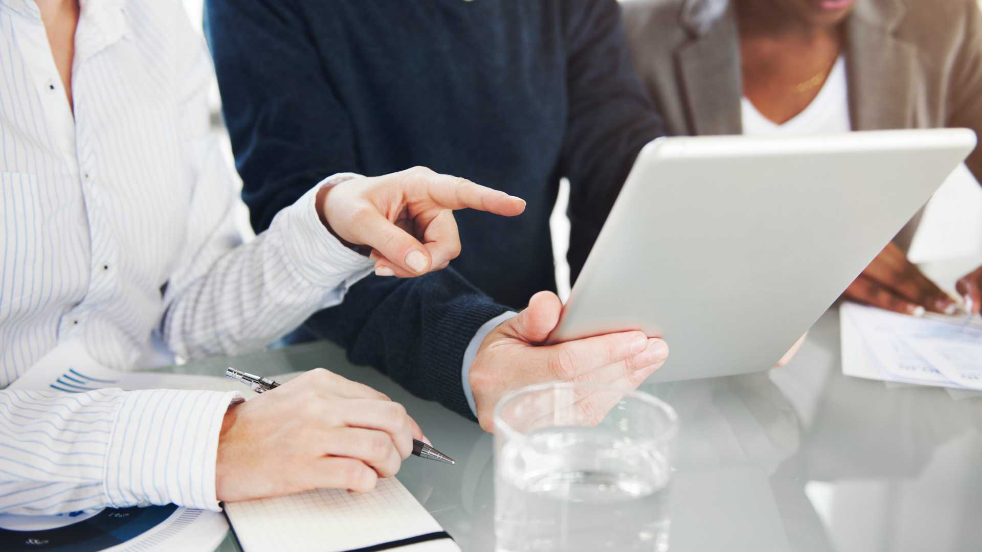 professionals looking at a tablet