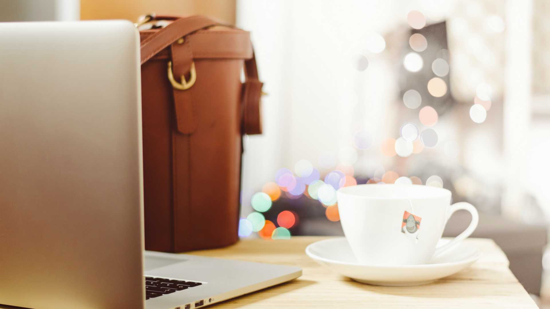 briefcase, laptop and cup of tea