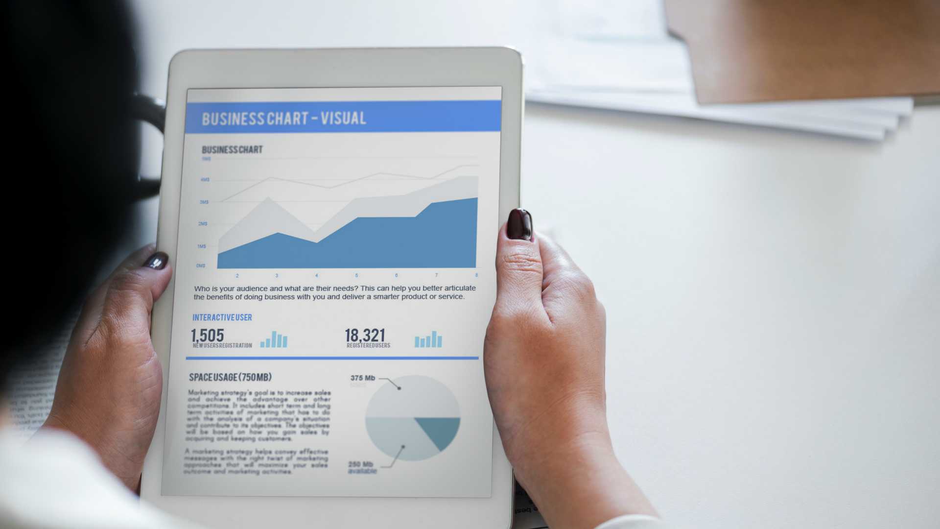 woman looking at charts on a tablet