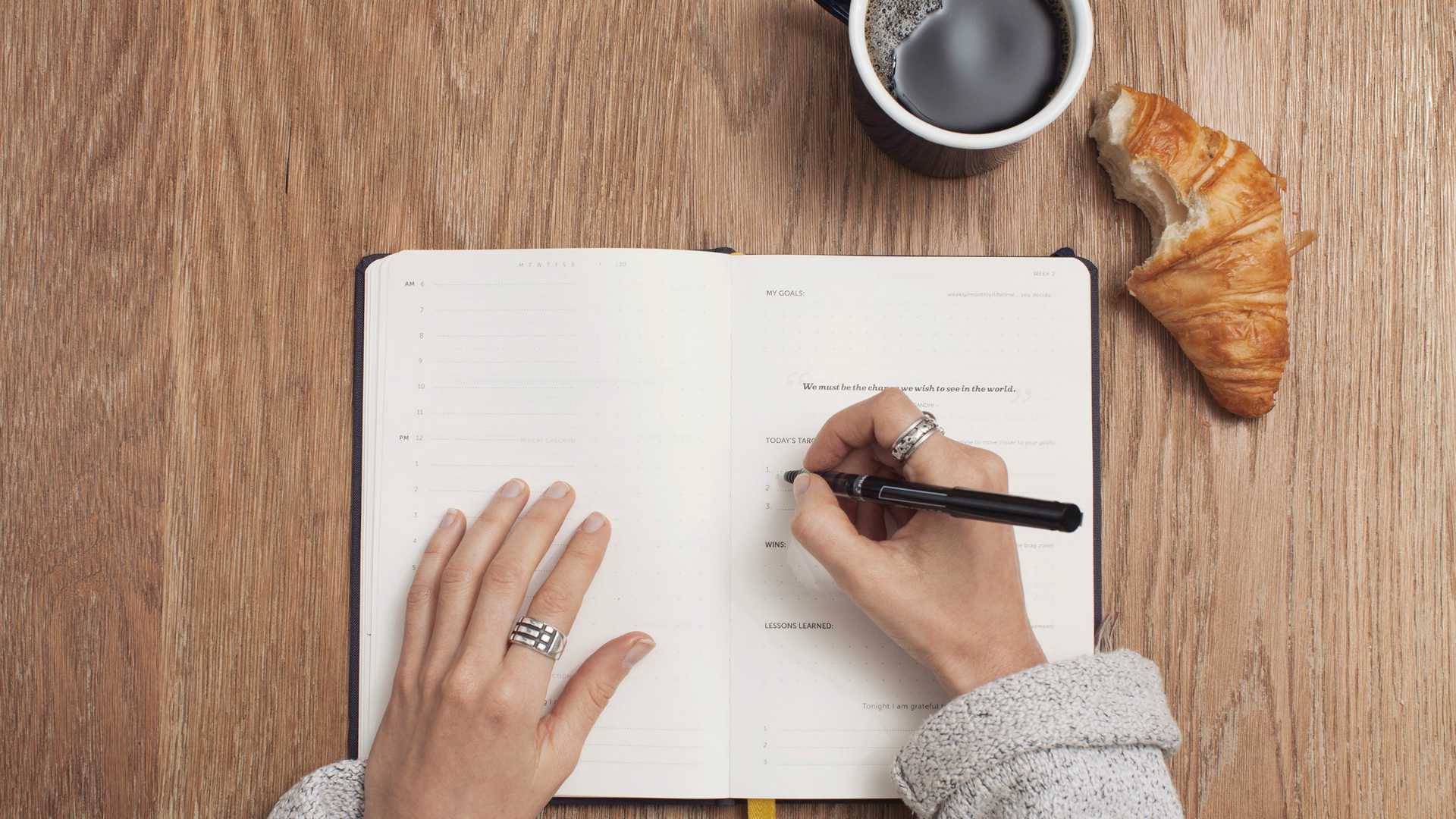 woman writing in a journal