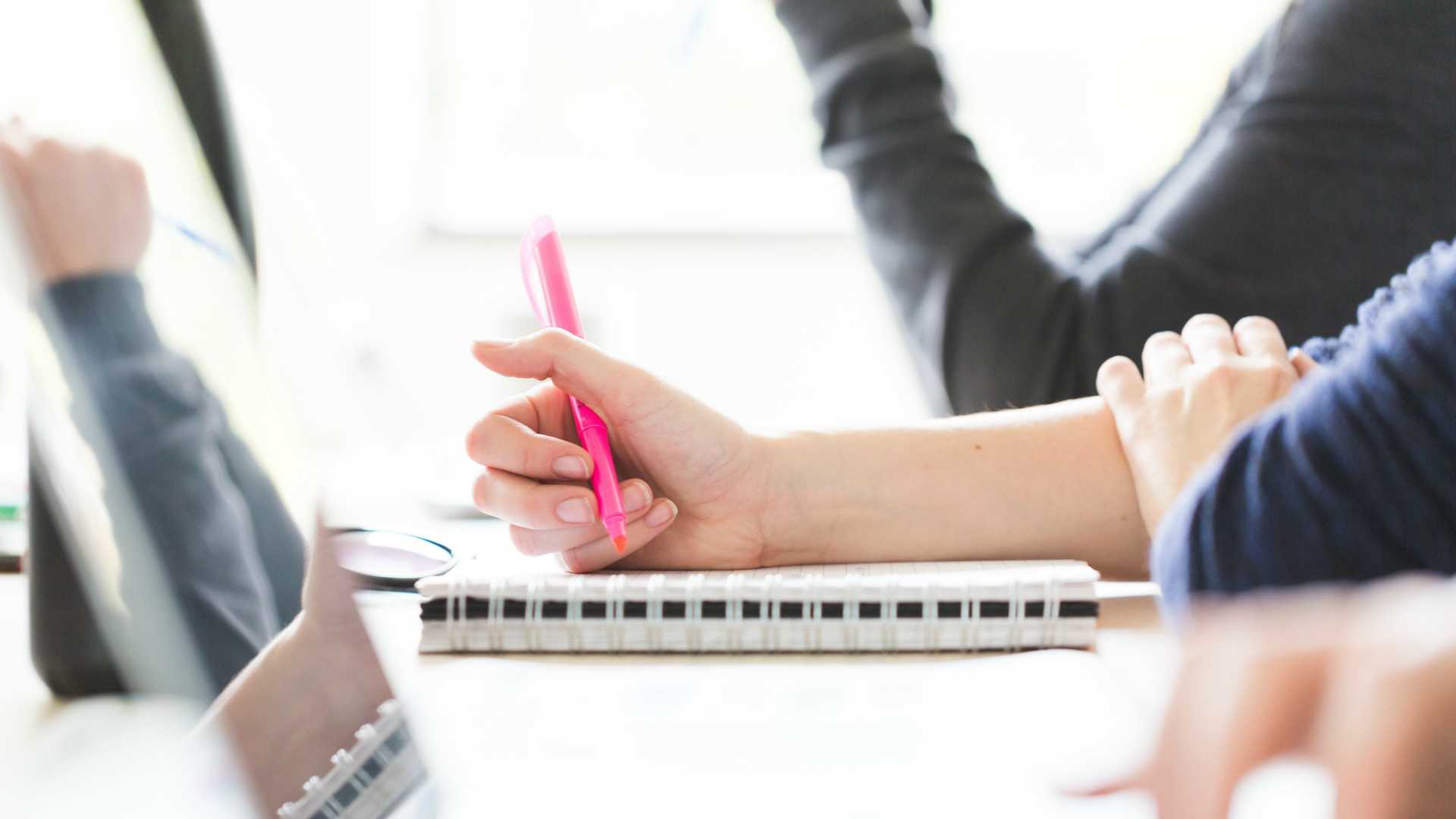 taking notes in a brainstorming meeting