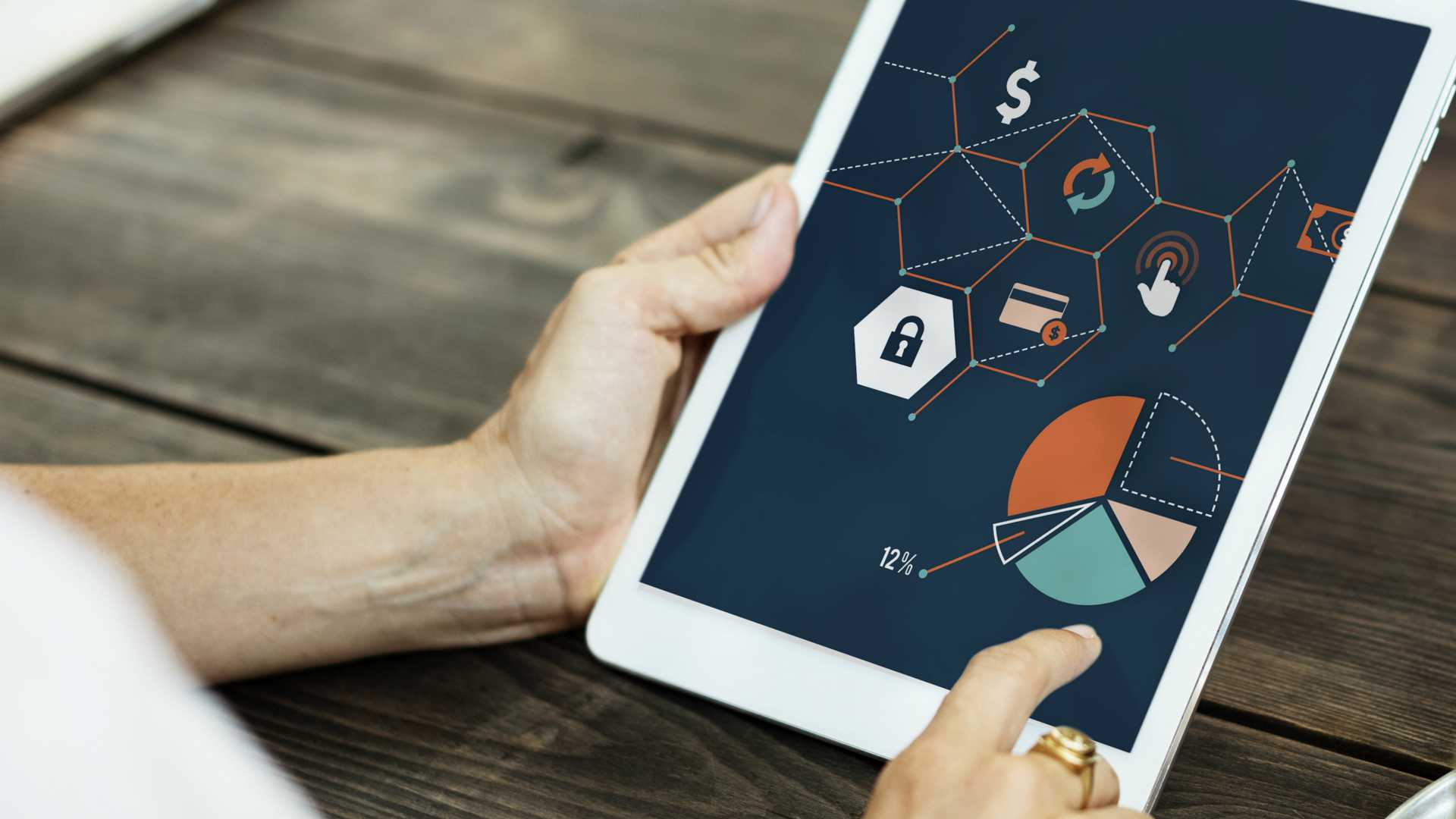 person using a table that has charts and graphics on it