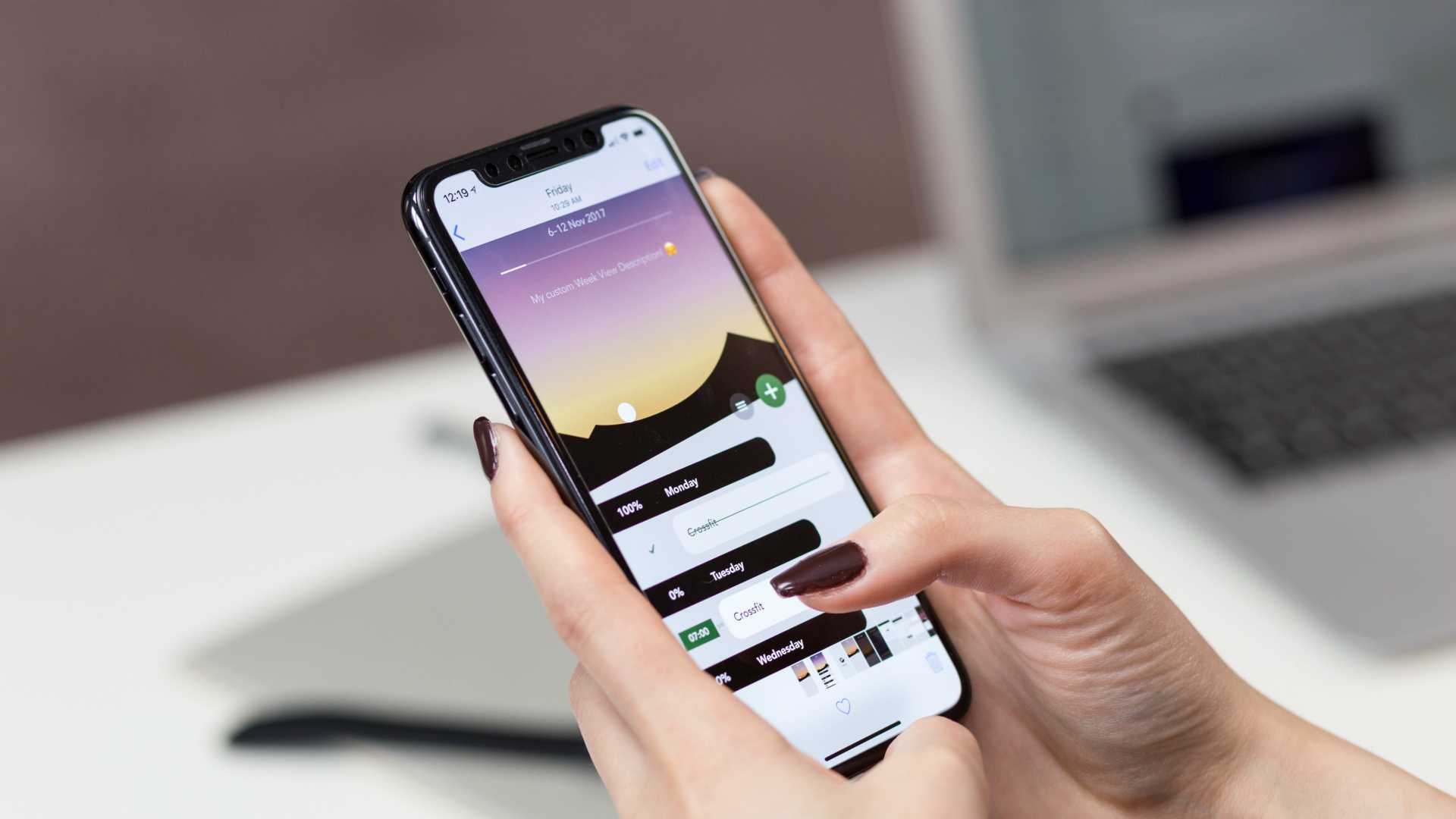 woman using a phone to set goals