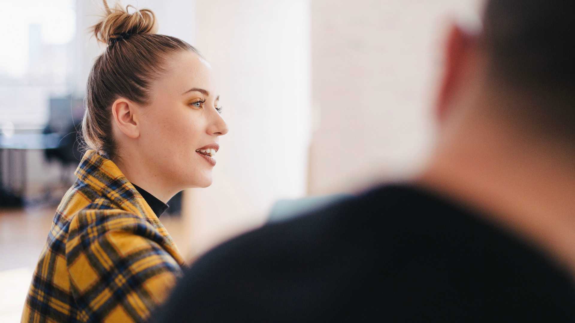young woman talking in a meeting