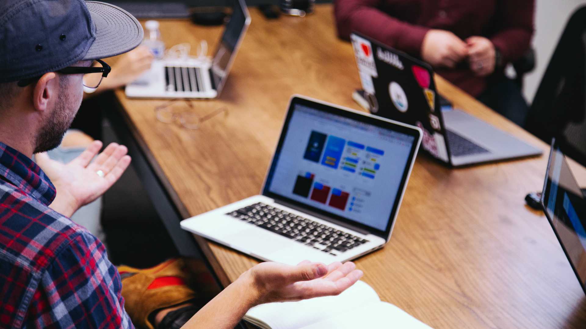 man speaking up at a tech team meeting