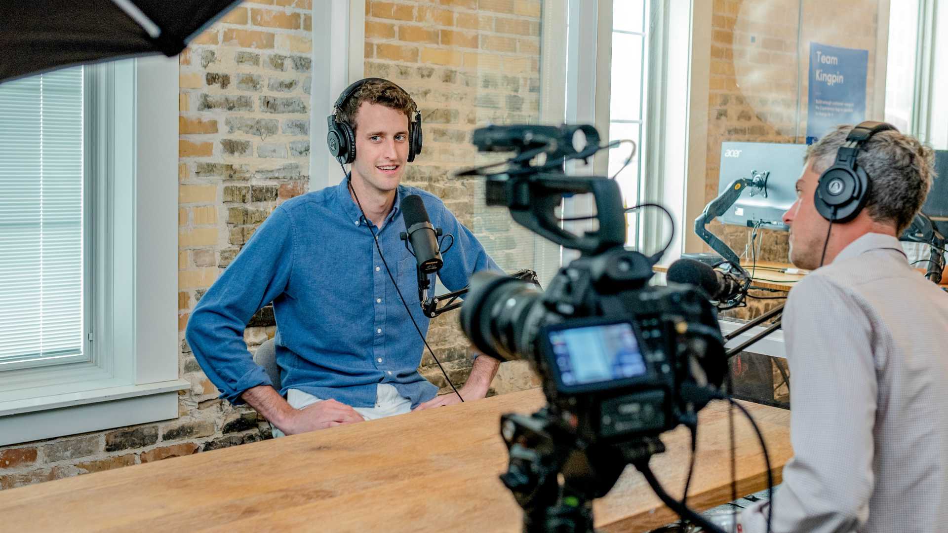 man being interviewed on video