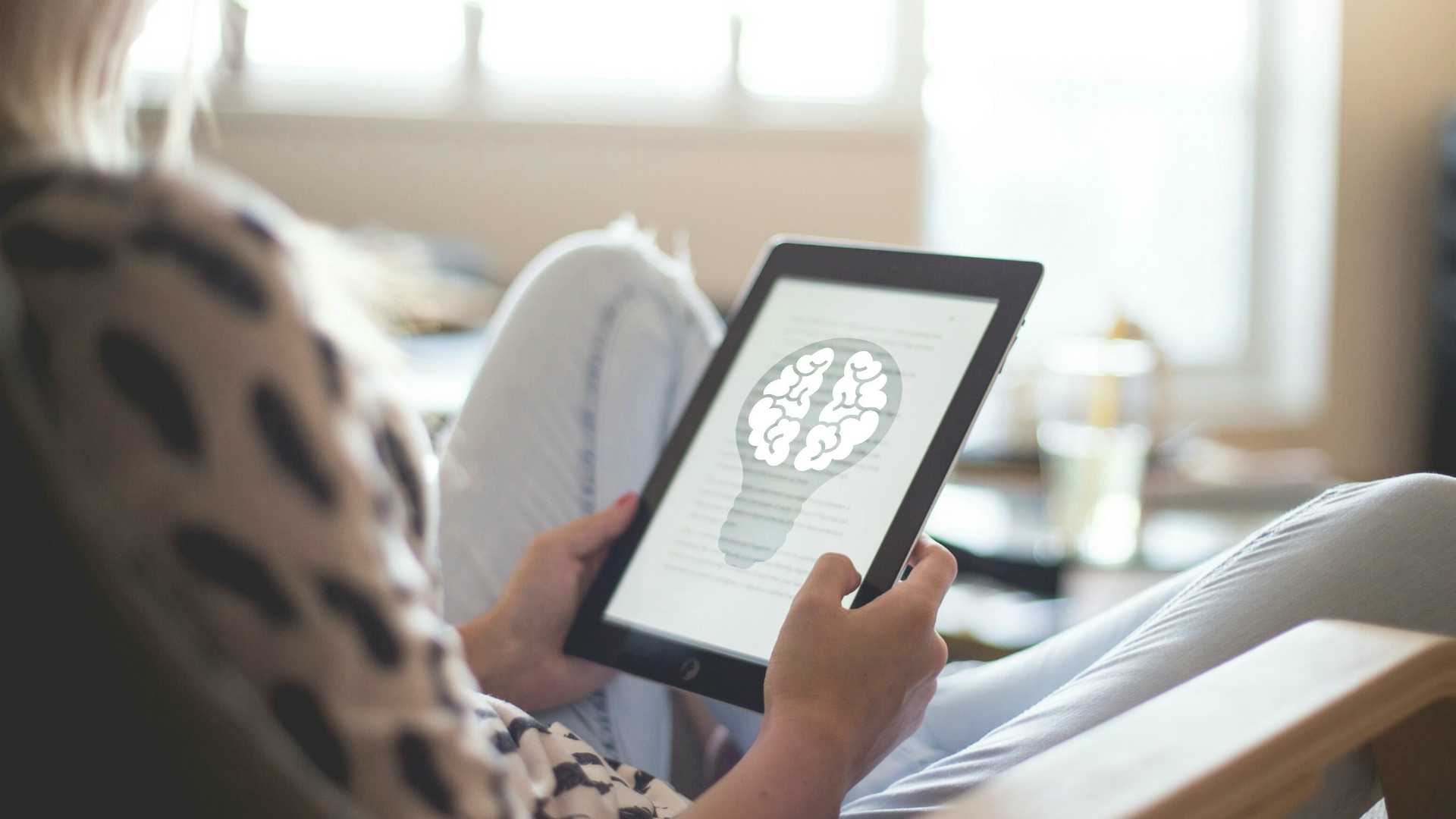 Woman accessing brain image on tablet