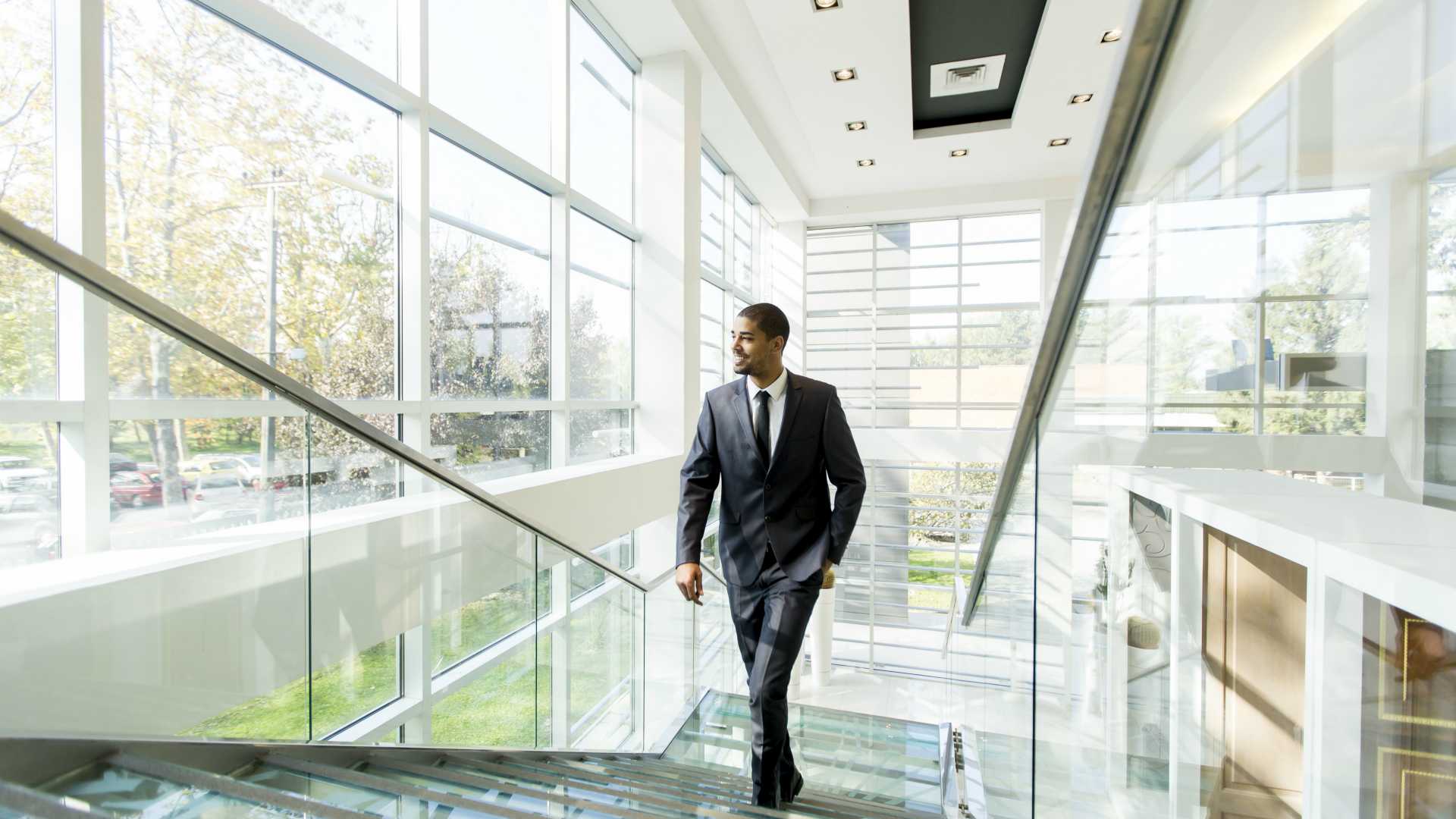 Modern black businessman on the stairs