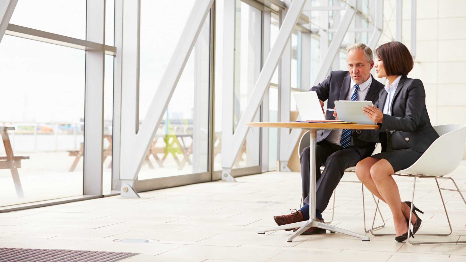 two senior business leaders meeting