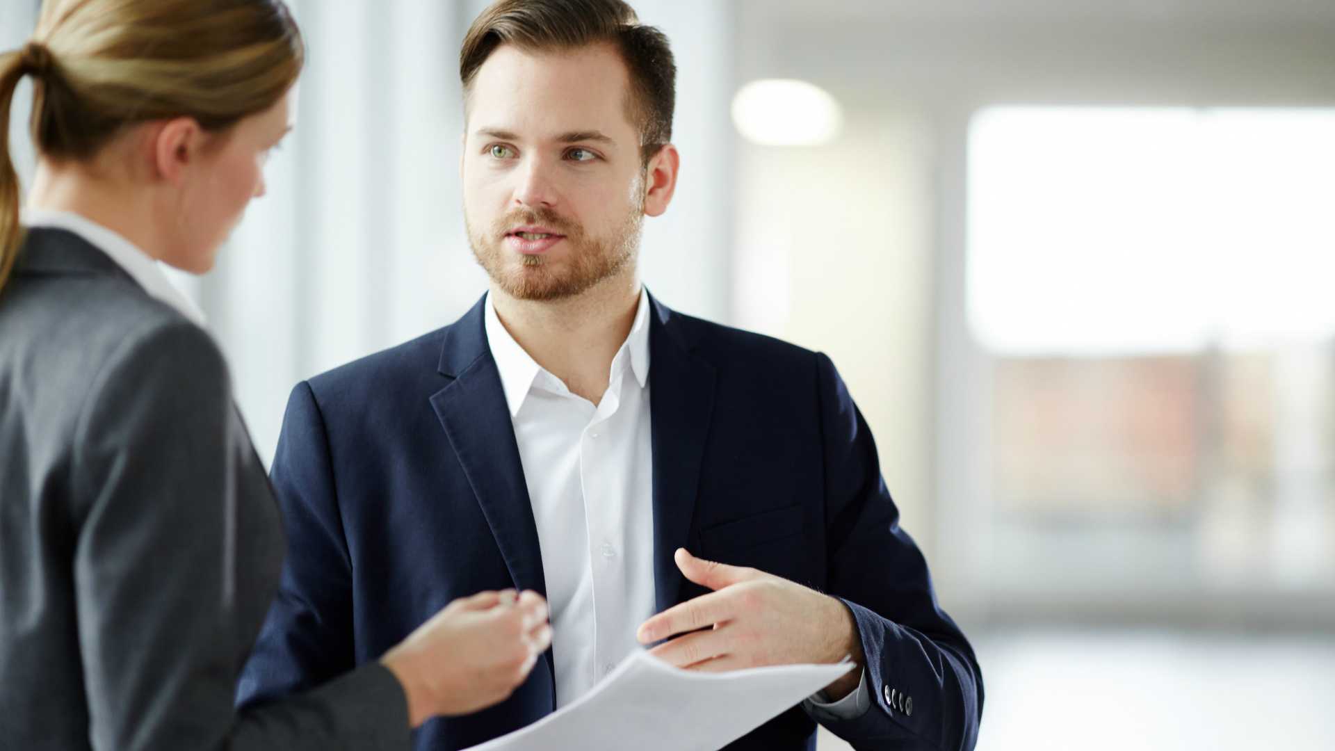 Businessman discussing business contract together with his partner