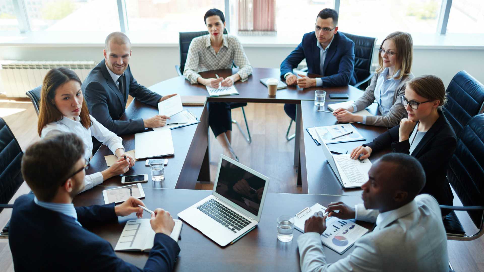 Businespeople at panel discussion in board room