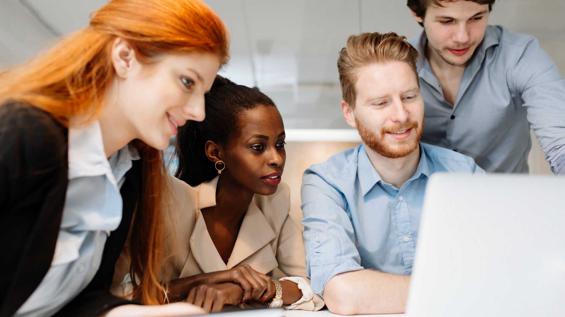 Skilled designers and business people working in tidy modern office