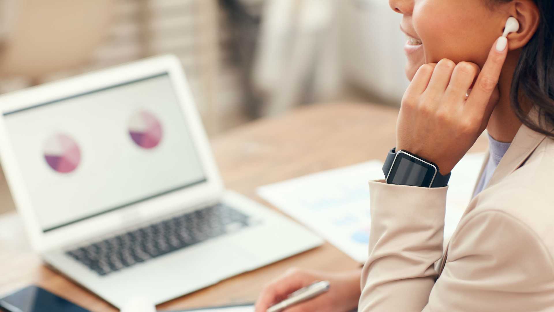 Young businesswoman reviewing data and measurements from latest training program on laptop computer