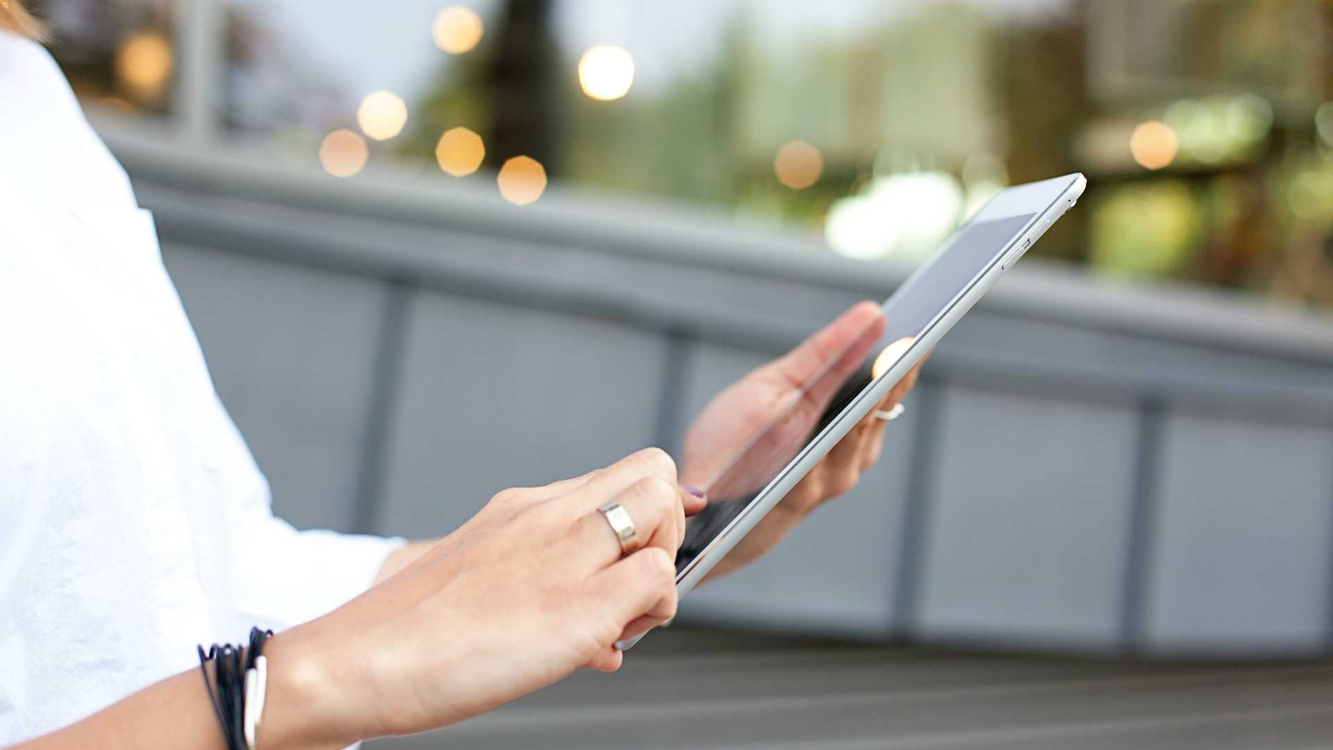 Businesswoman holding tablet on outdoor office patio